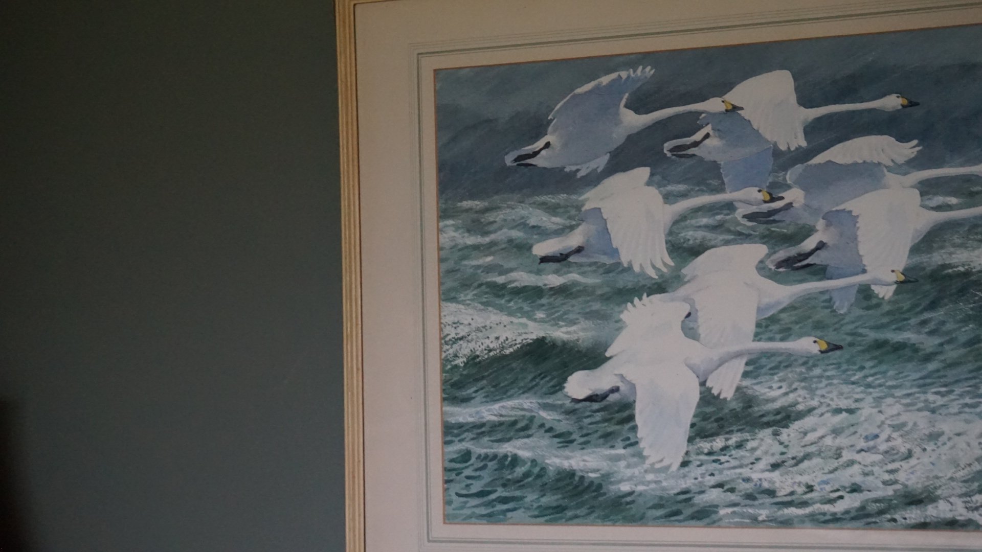 Coastal-inspired artwork of swans in flight above rolling waves, styled within a country house refurbishment in Anglesey, North Wales by Stiwdio Interior Design, celebrating heritage, landscape and layered interiors.