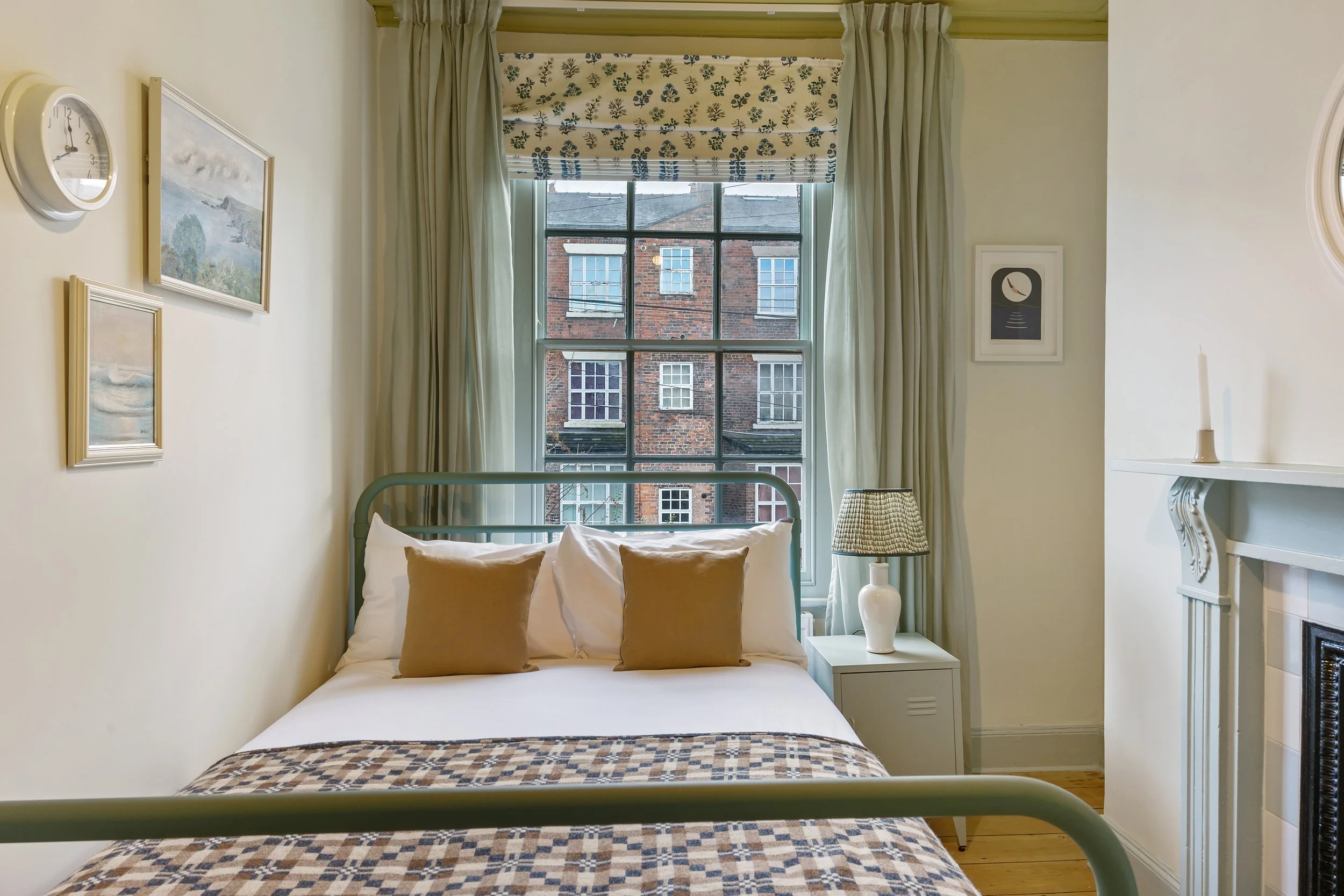 Georgian Quarter Liverpool holiday let bedroom blending heritage colours, Welsh-inspired textiles and period charm for a boutique city stay.