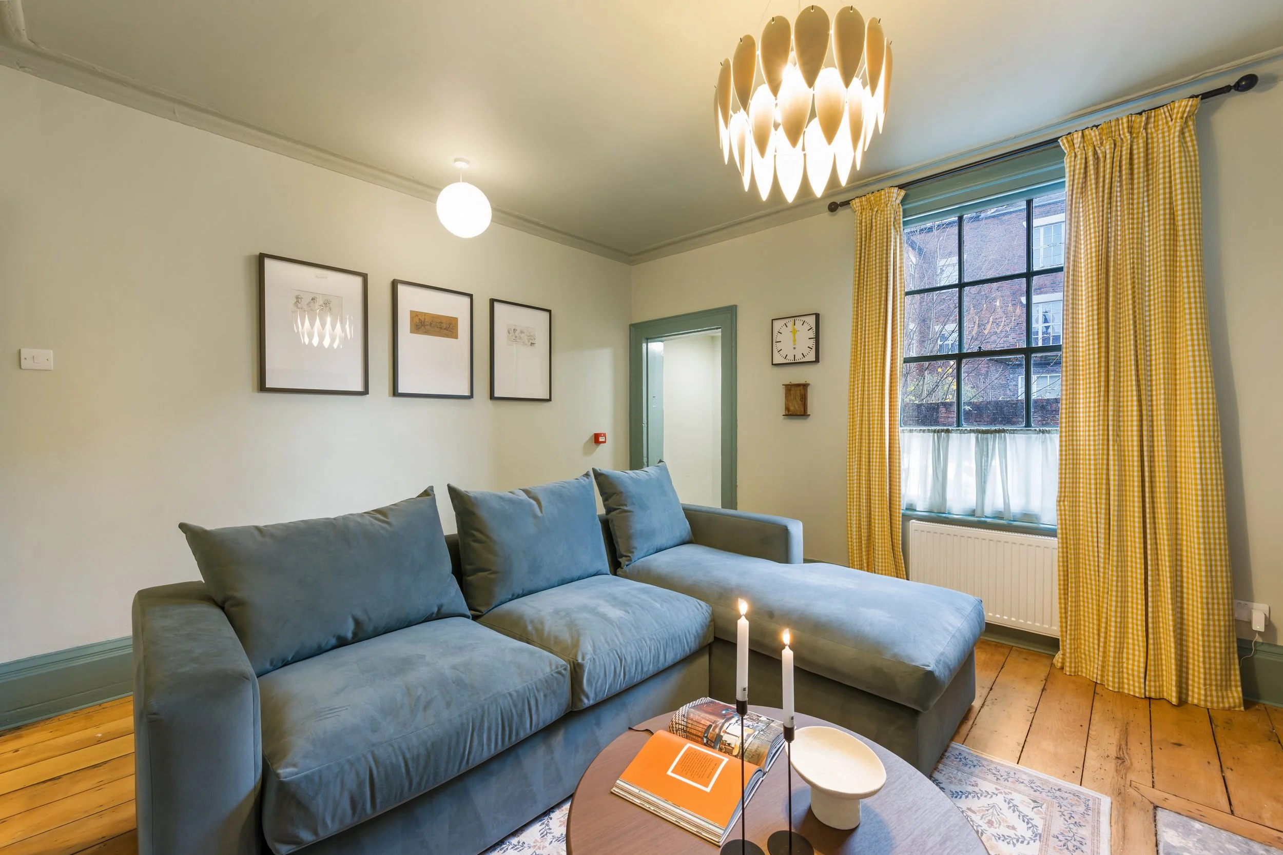 Stylish Georgian Quarter Liverpool holiday let living room featuring heritage sash windows, Welsh-inspired textiles and boutique design details.