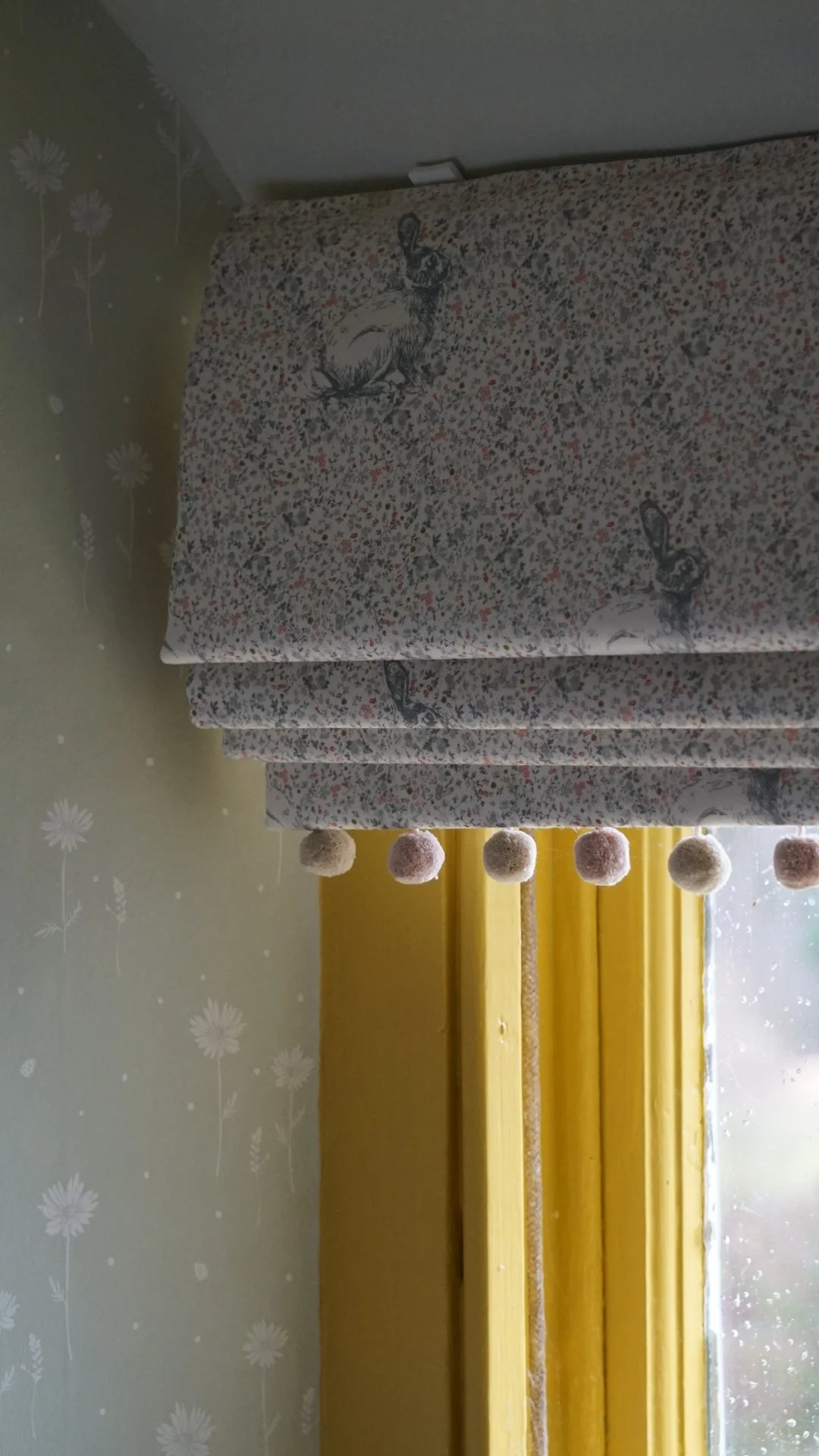 Anglesey country house refurbishment showcasing bespoke rabbit print Roman blinds with playful bobble trim, layered heritage interiors by Stiwdio Interior Design, North Wales.