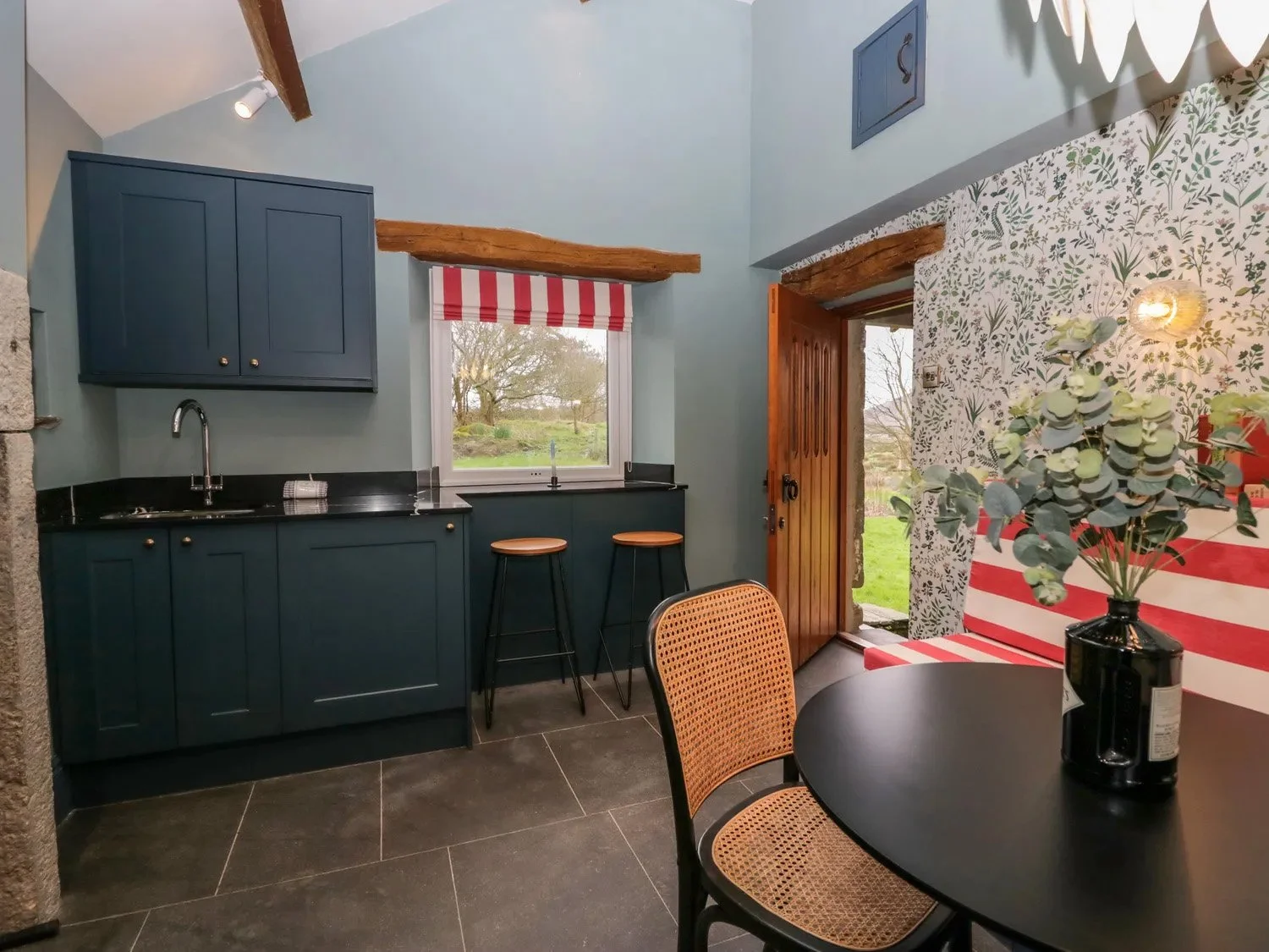Lake District cottage kitchen renovation in Cumbria featuring painted cabinetry, exposed beams and modern country interior styling.