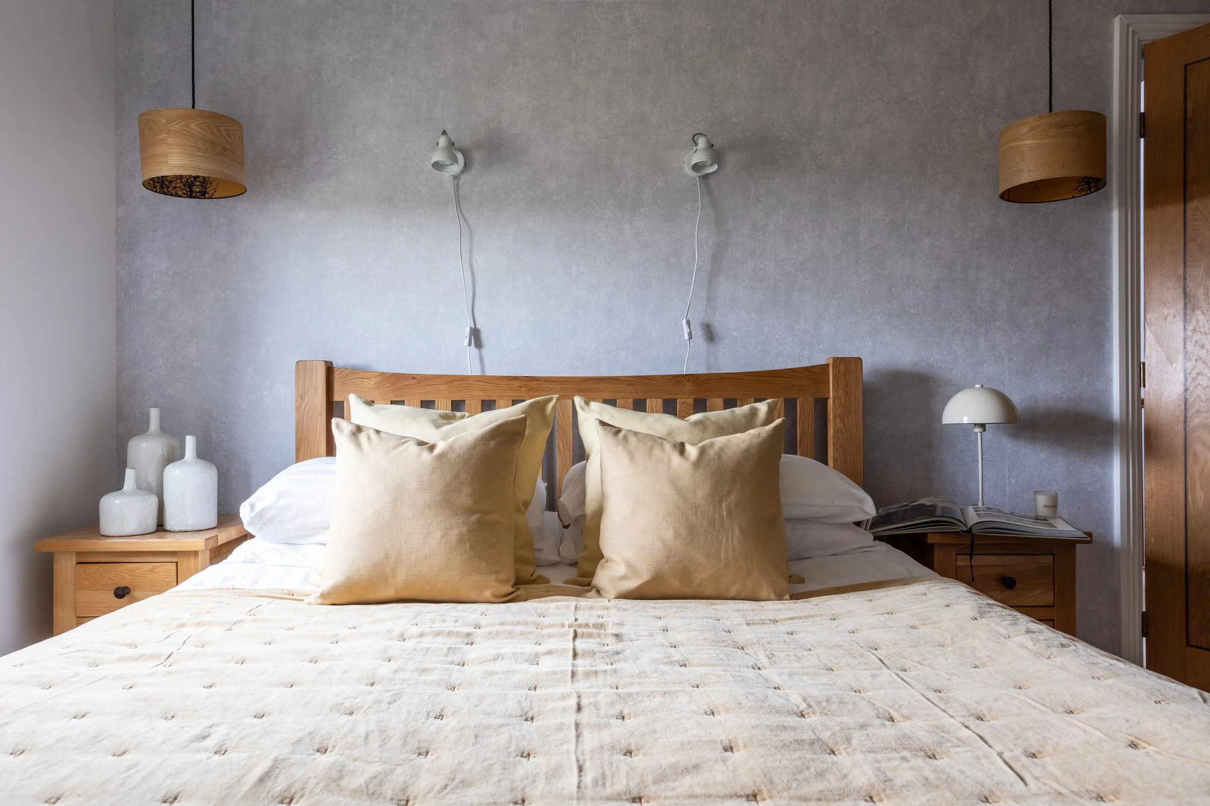 Holiday let in Rhosneigr, North Wales with beach house bedroom styling, natural wood furniture and calm coastal tones.