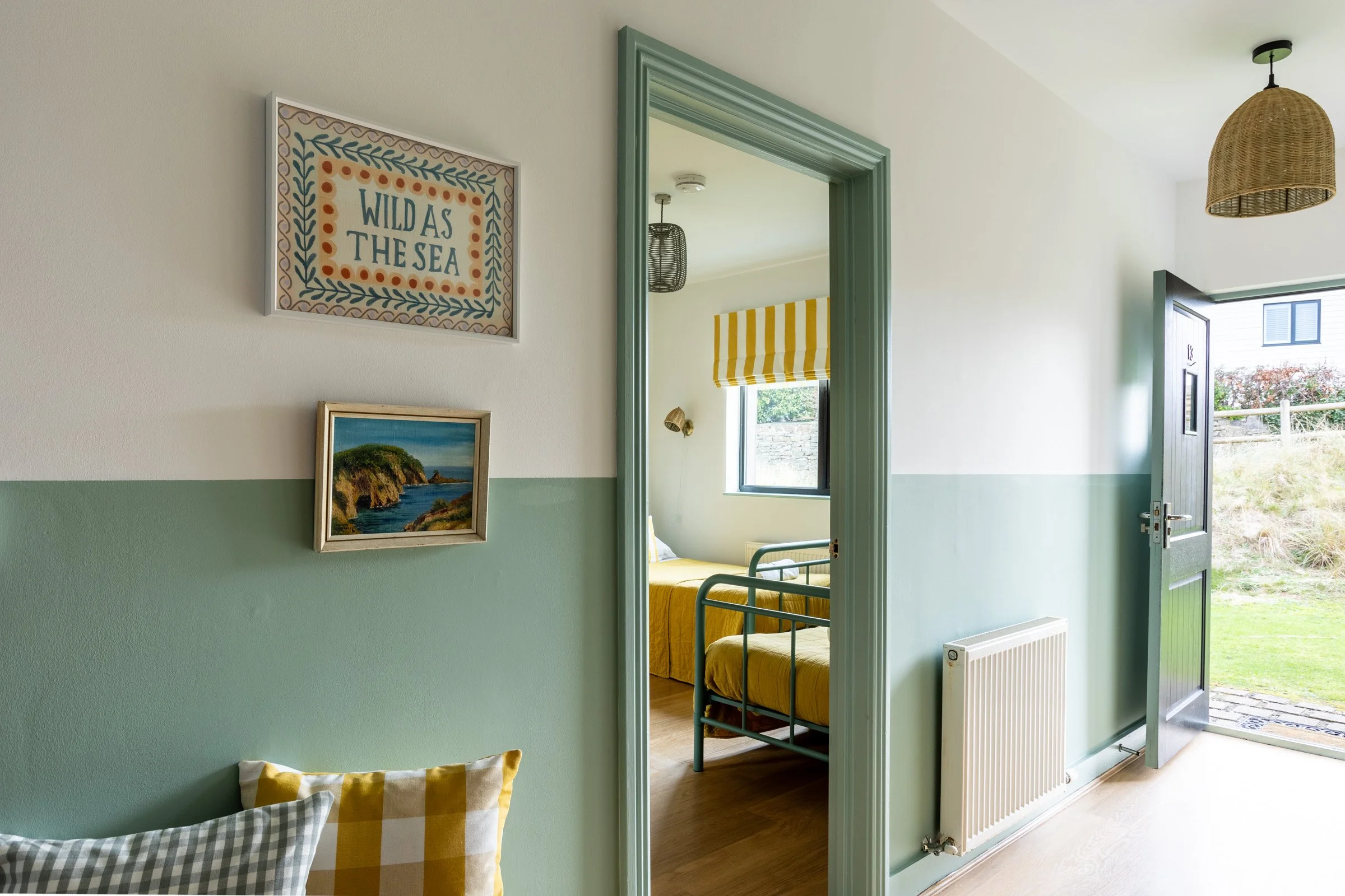 Holiday let in Rhosneigr, North Wales with beach hut décor, coastal wall art and bright seaside interiors.