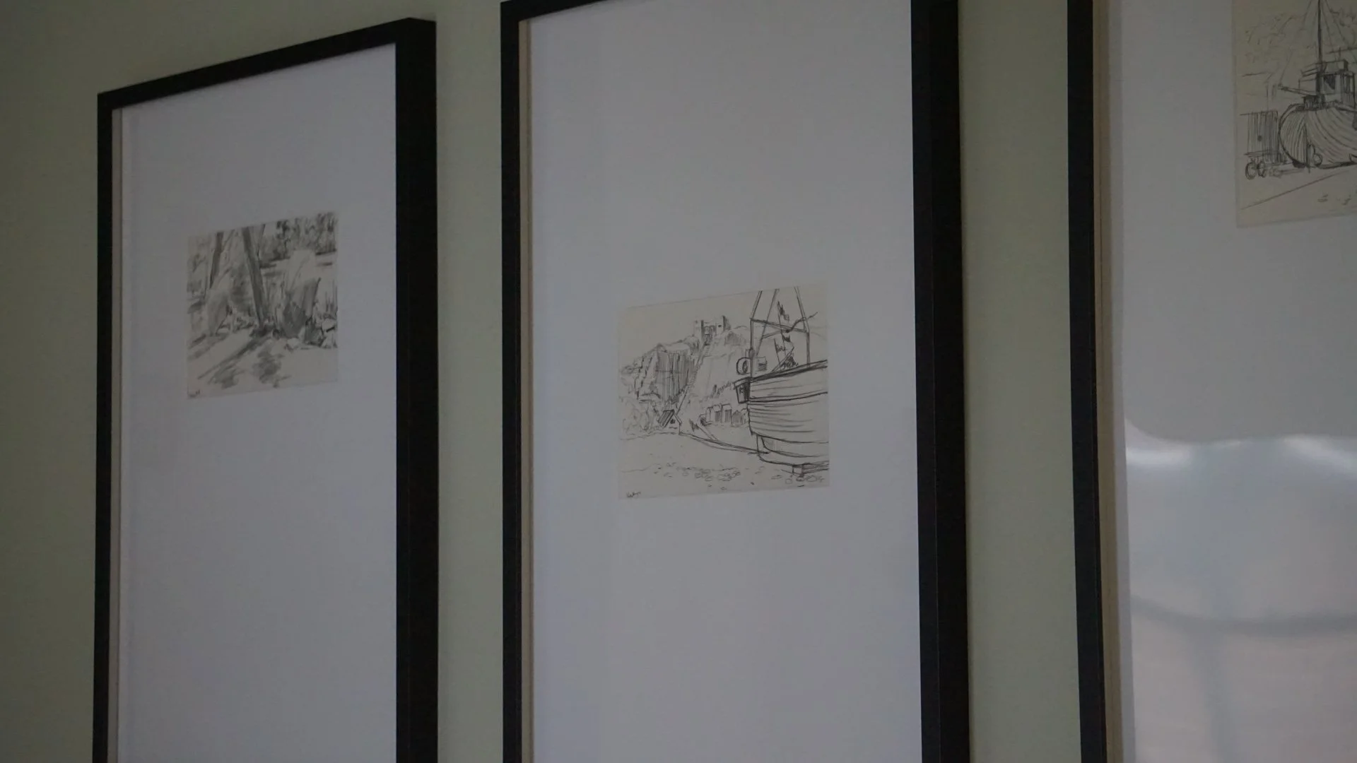 Framed original sketches and artwork in a Georgian Quarter Liverpool holiday let celebrating coastal heritage and boutique interior styling.