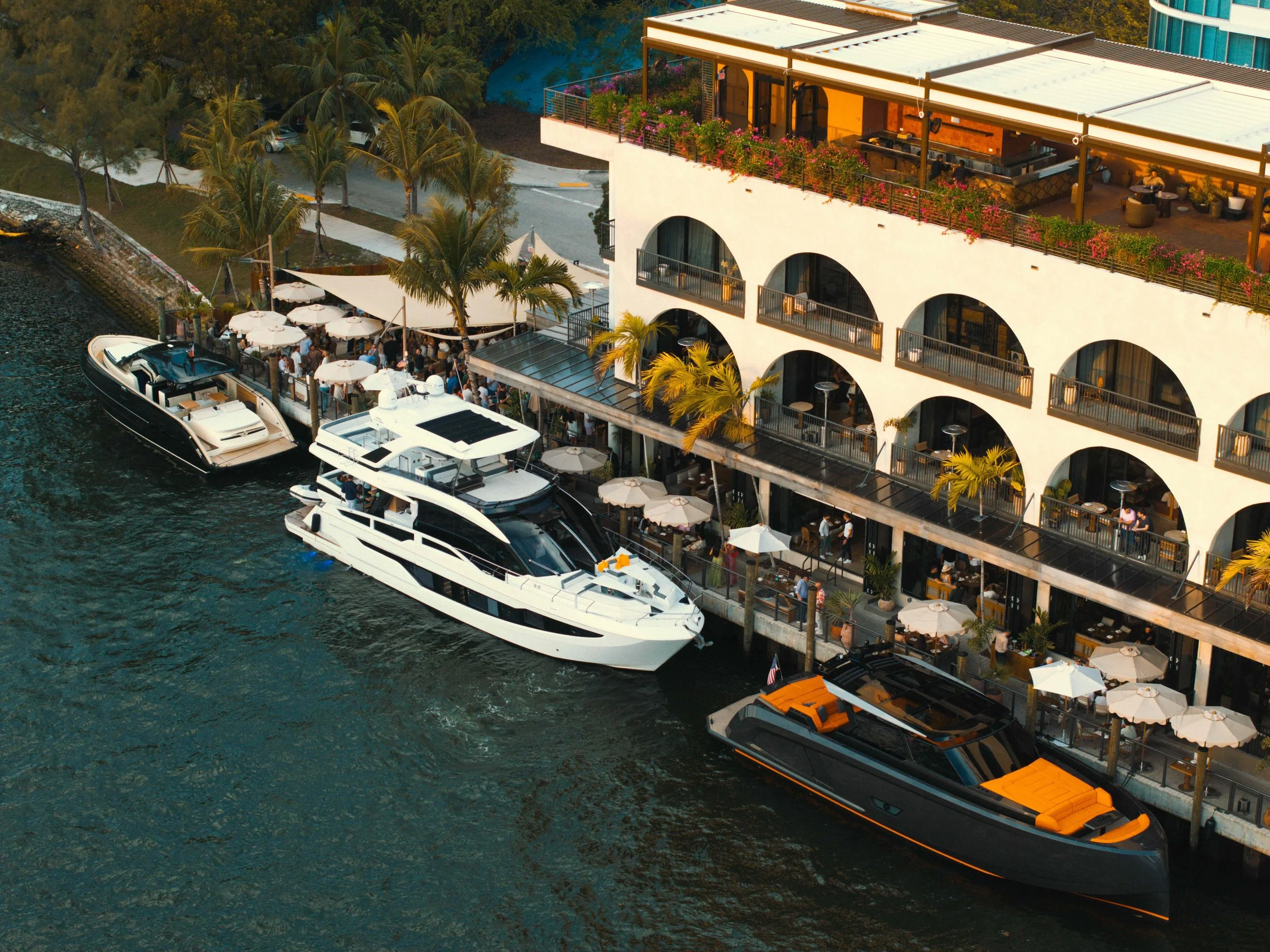 Waterview with three yachts docking for CASA NEOS beach club, restaurant, lounge, and rooftop.