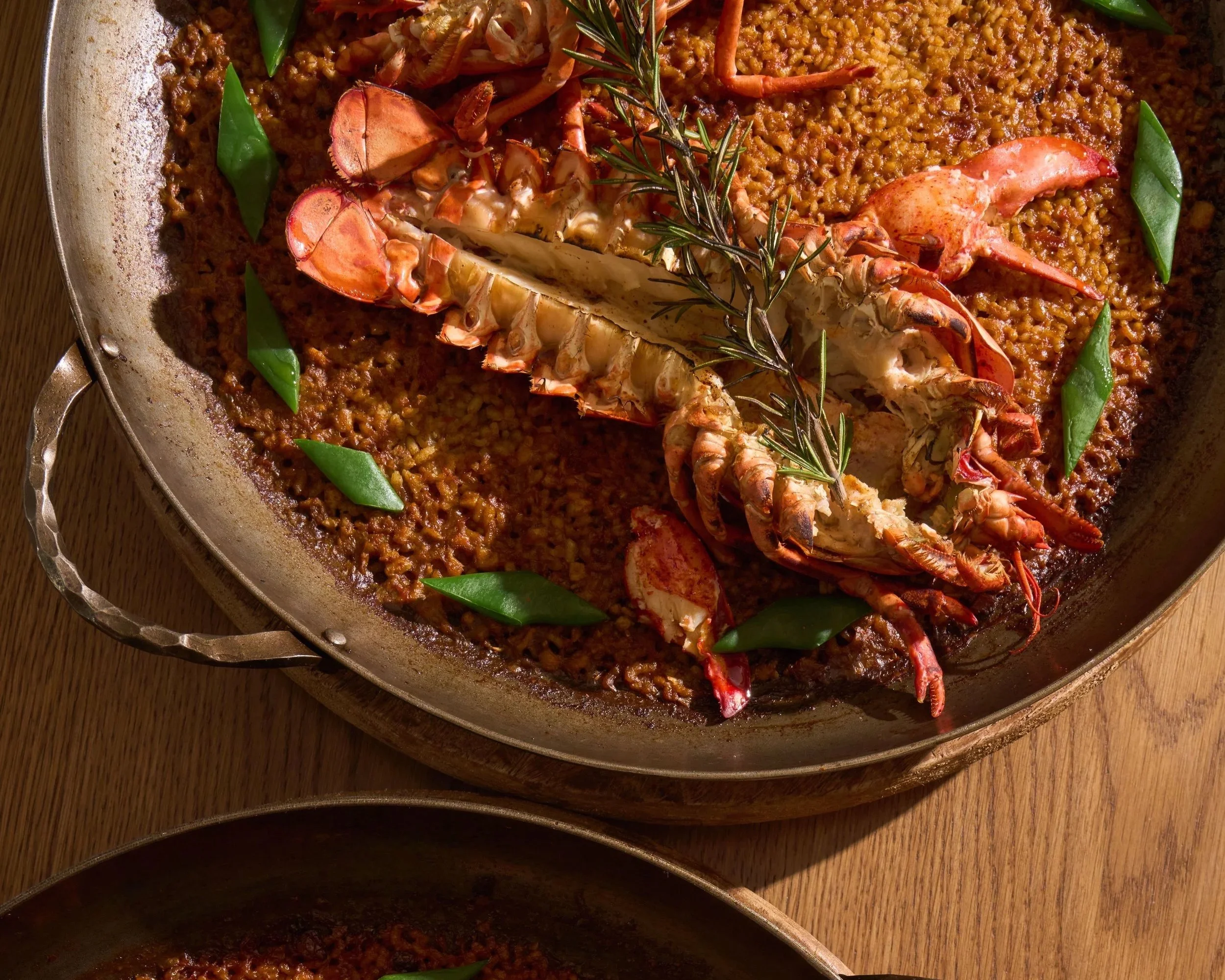 CASA NEOS Paella dish, with lobster in the center.