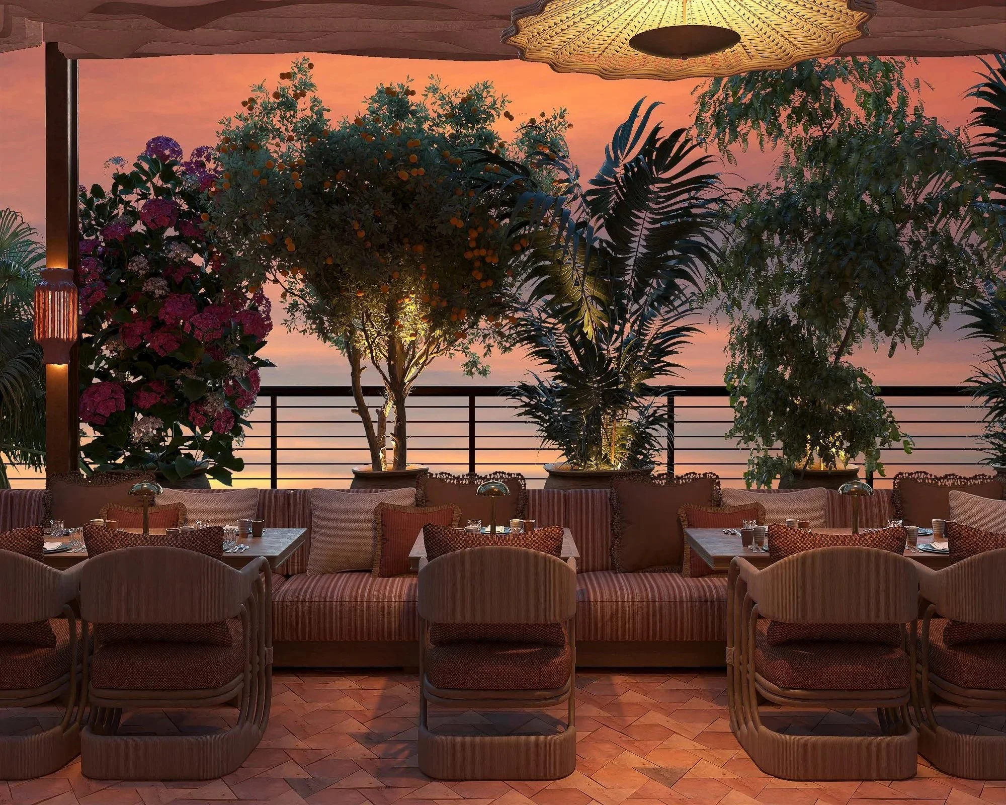 The CASA NEOS members-only rooftop area during sunset hours, with comfortable chairs and a table near plants.