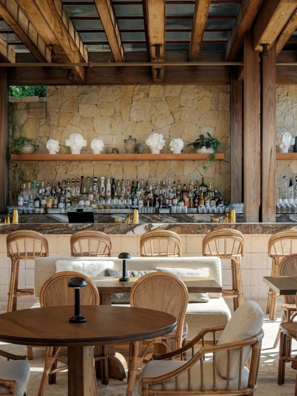 Outside view of CASA NEOS bar with costal & elegant tables and chairs