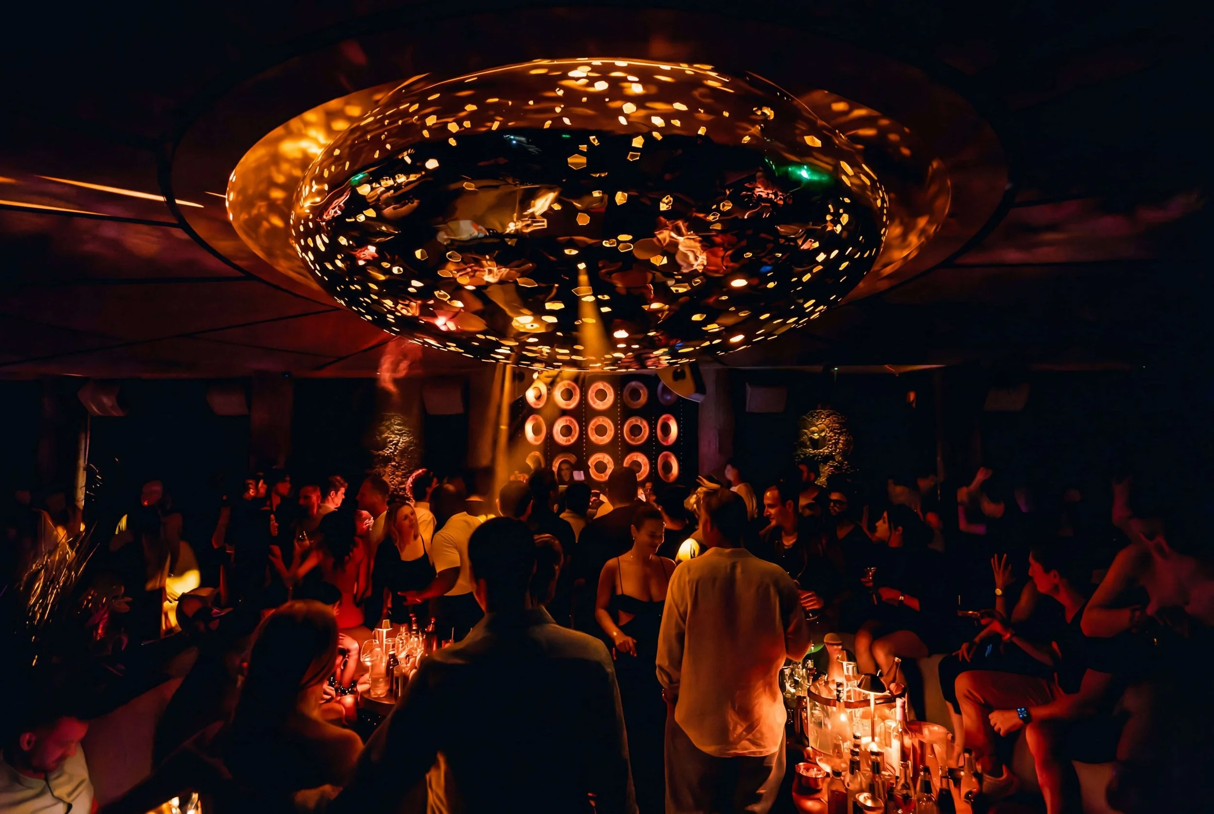 CASA NEOS Lounge, with guests dancing under the big disco light.
