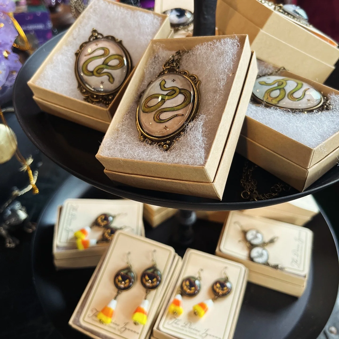 Snakes, jack-o-lanterns, cats and bats!! We love the vintage vibe of all the new handmade halloween jewelry in stock by @divineiguana ✨🐍🎃 

Available at our brick and mortar shop Tuesday-Saturday 11am-6pm in #columbusgeorgia 

#smallbusiness #shops