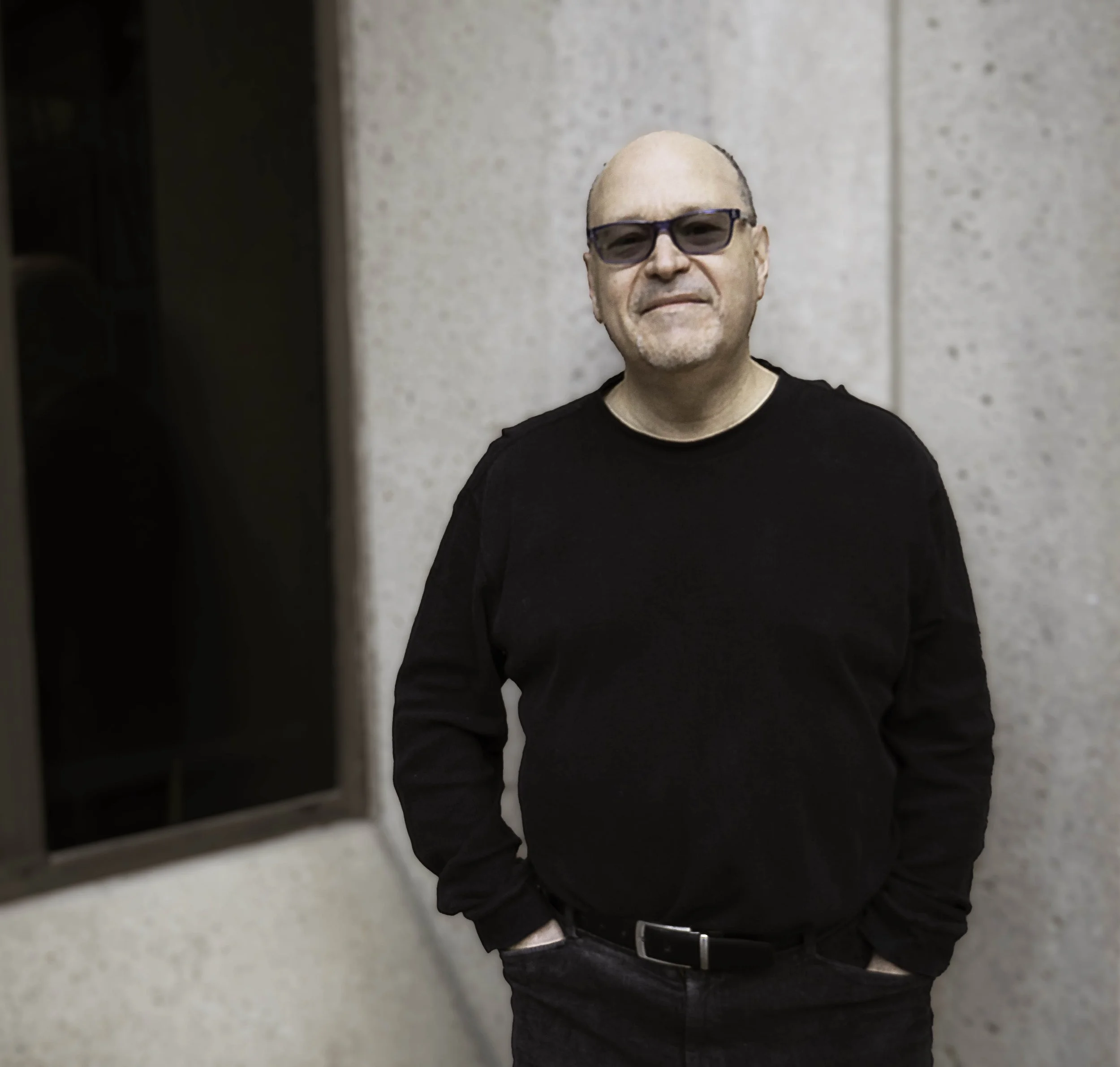 Photo of smiling man with glasses