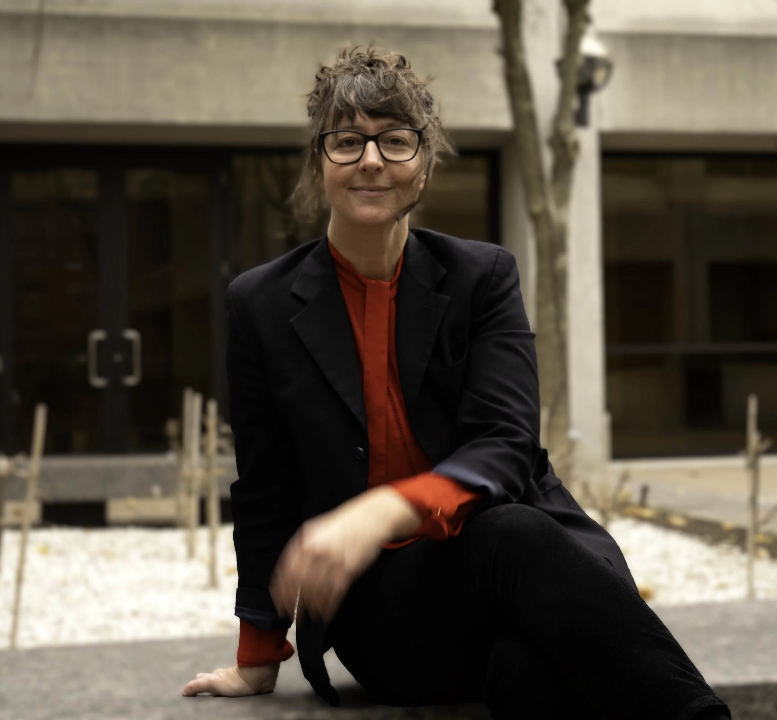 Photo of smiling woman with glasses