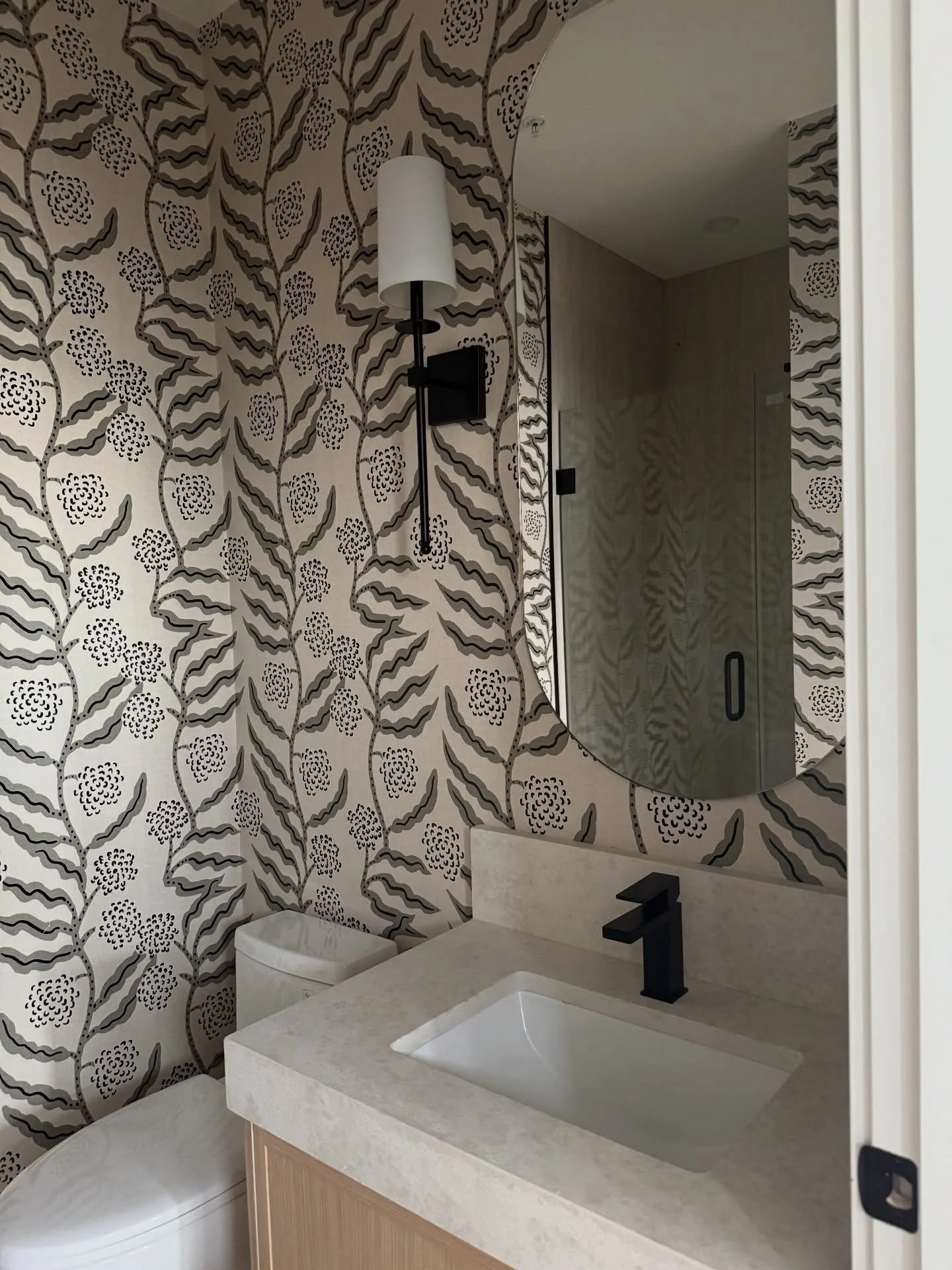 Florals can shift a space emotionally: energizing at first glance, then quietly comforting the longer you&rsquo;re in it. Playful, optimistic, and effortlessly balanced. #wallpaper #powderoom #bathroominspo @heritagepaintinganddecorating