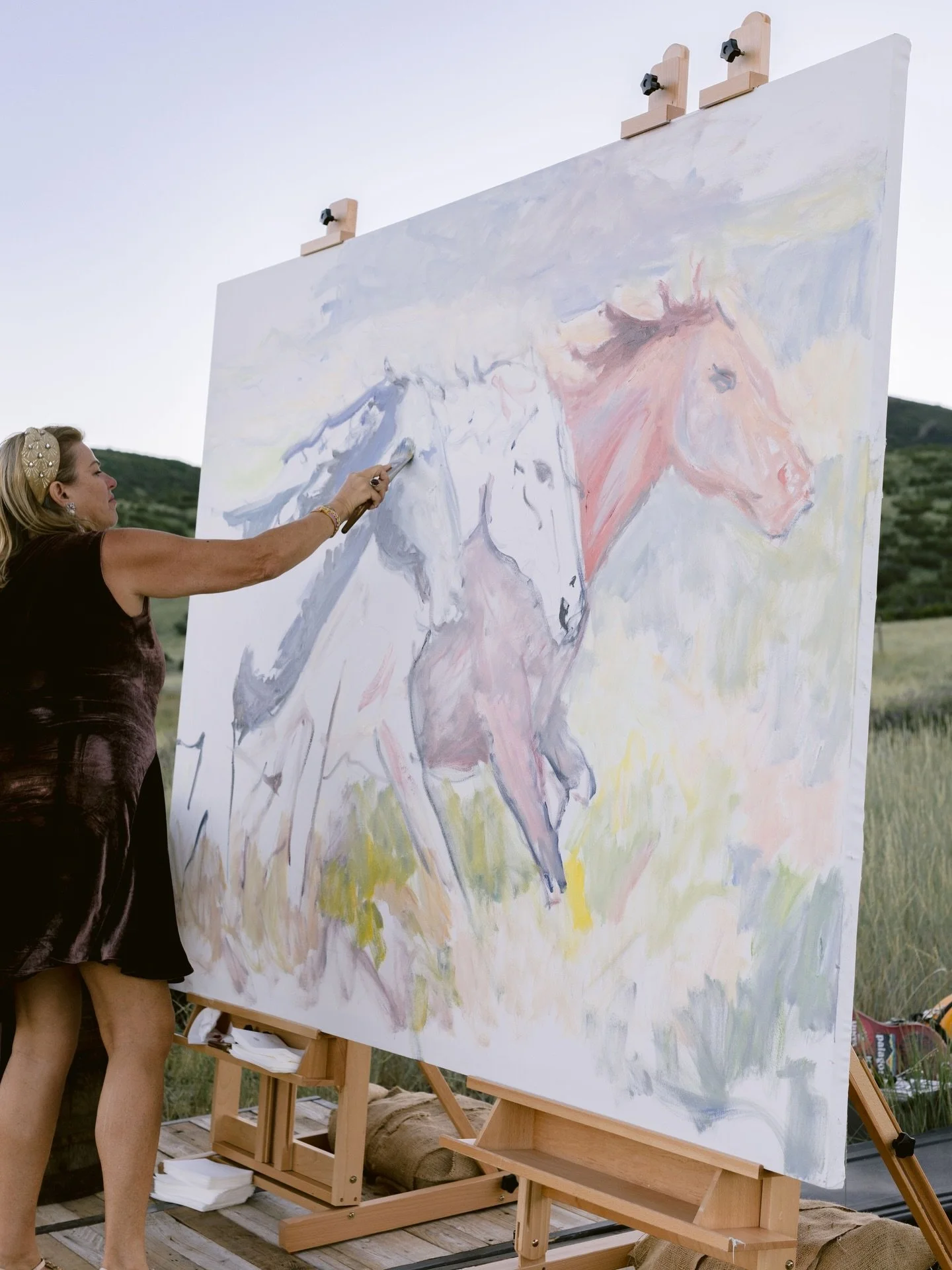 A canvas coming to life, horses in the pasture, live music under an endless sky, and a gathering of people you never want to leave. Summer nights at TAG Ranch are something special.🌾✨

Photographer: @sparkle_illuminating 
Artist: @joseenadeau_artist
