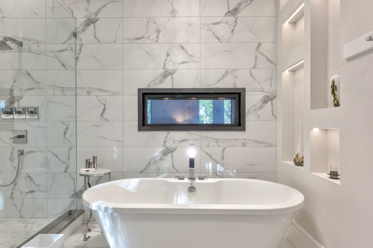 Modern Bathroom with Freestanding Tub and Window