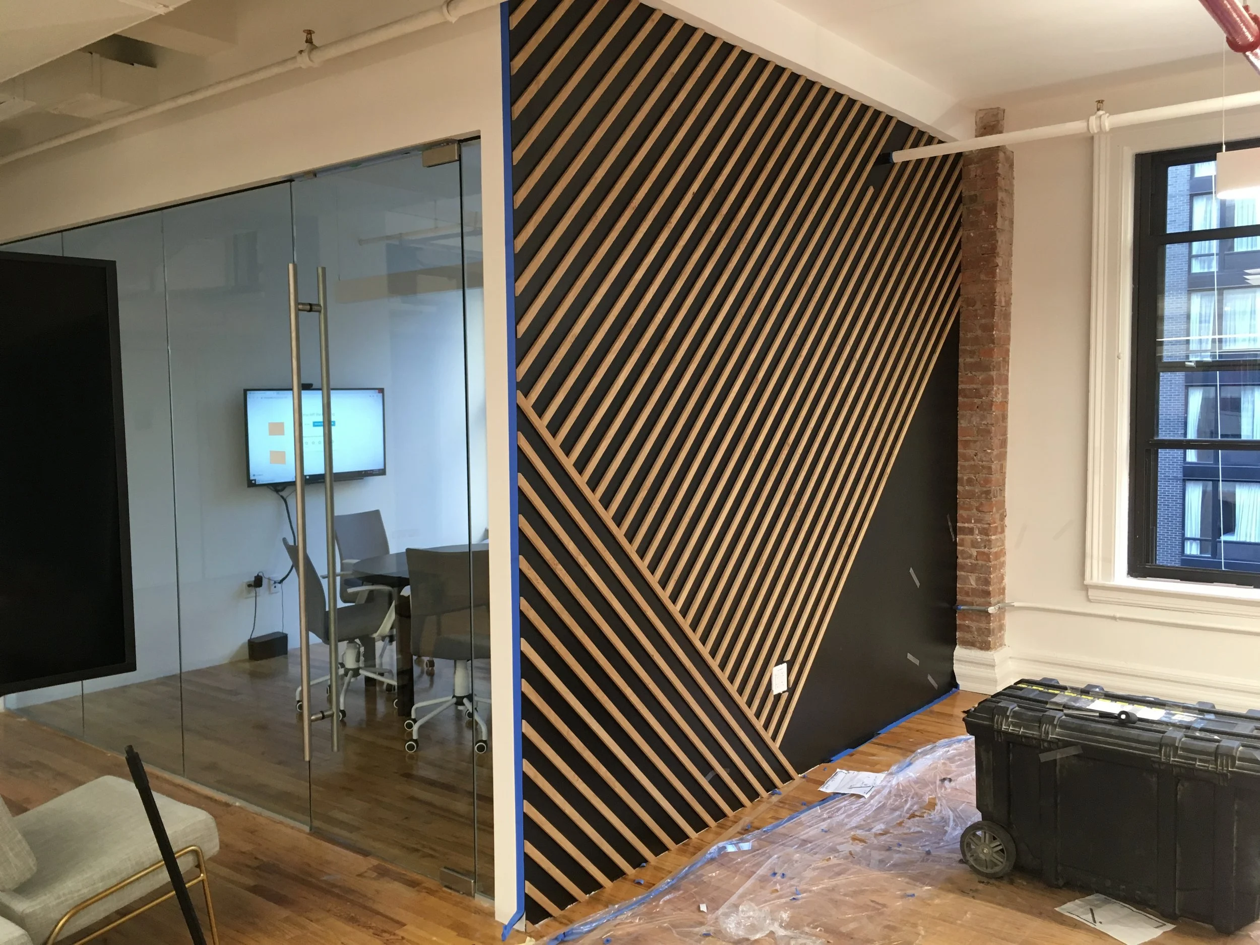 Wall feature: wood mounted on drywall.