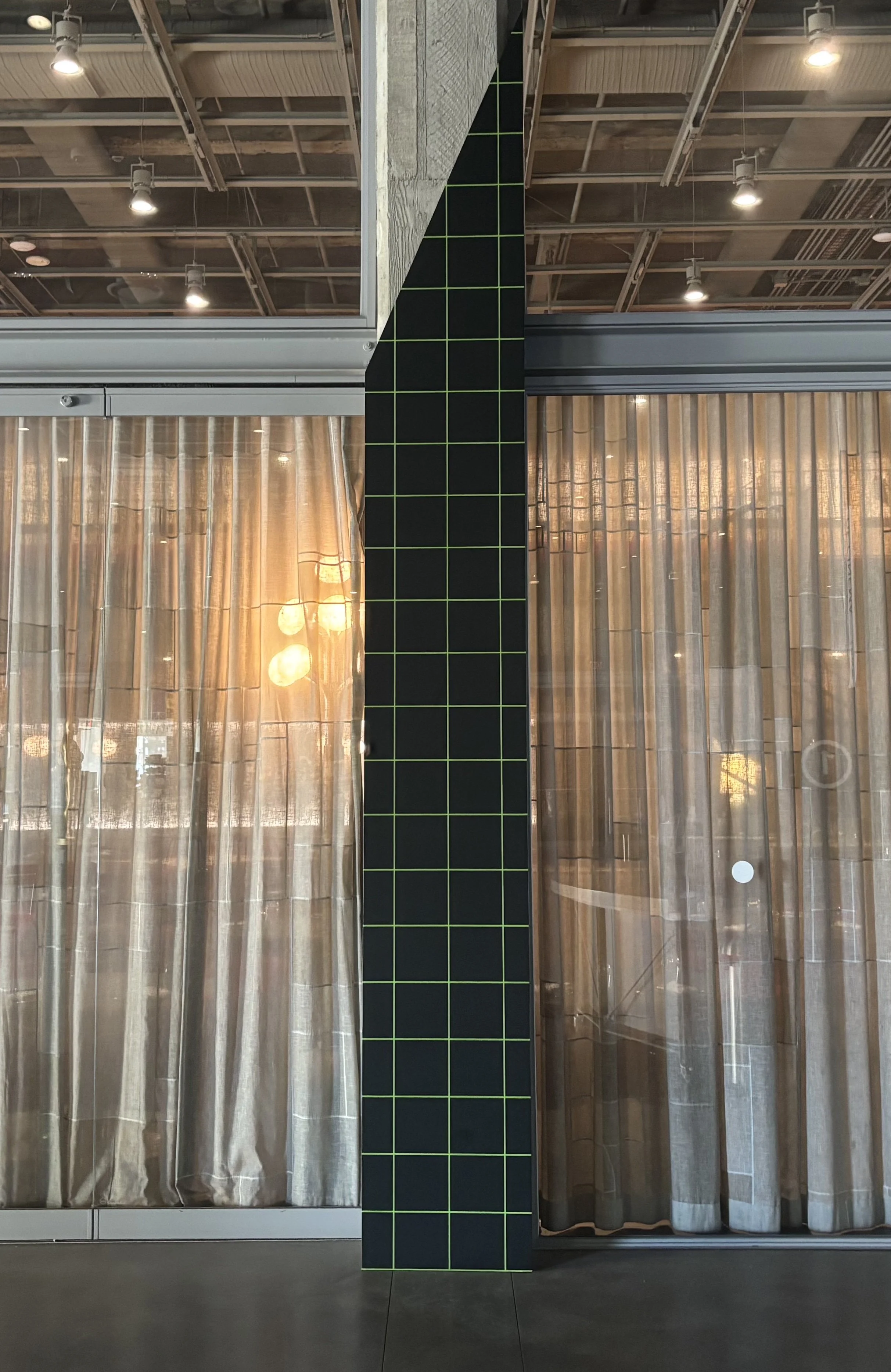 Concrete column wraps in wood and MDF with hidden magnetic installation hardware.