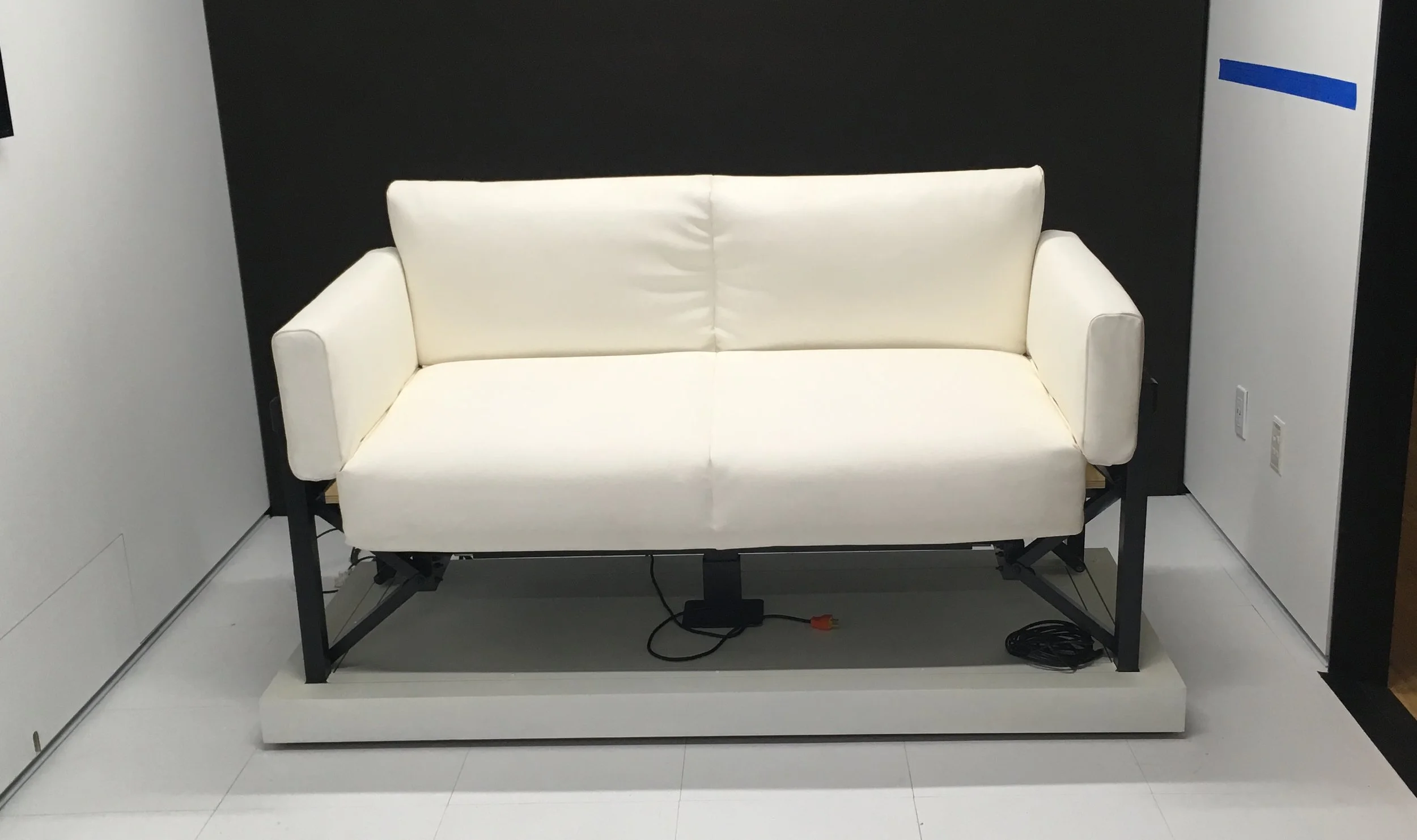 Custom kinetic couch/bed. Welded aluminum and mechanical assembly for an installation promoting cell phone technology.