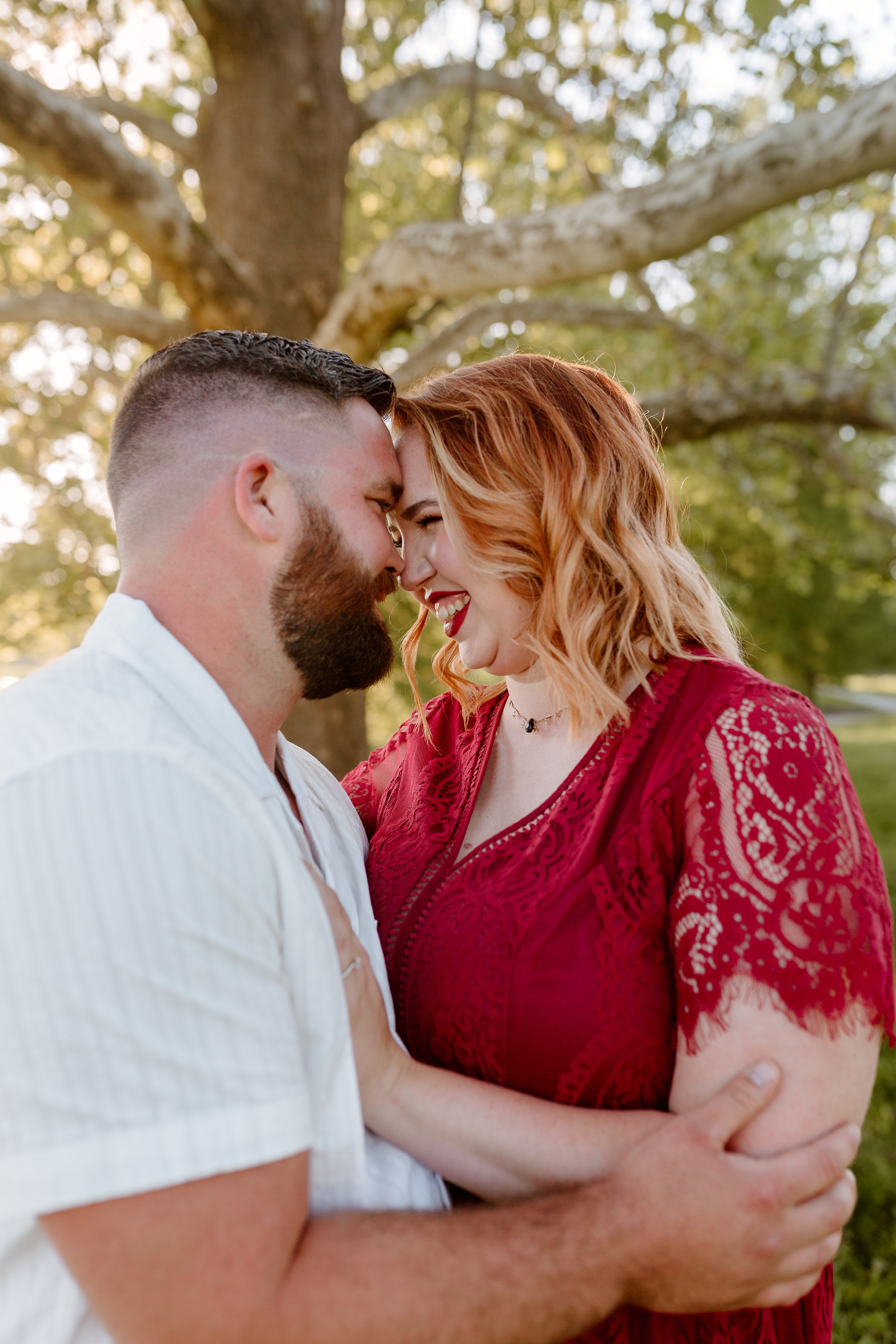 engagement photos of a couple in bernheim forest in Kentucky