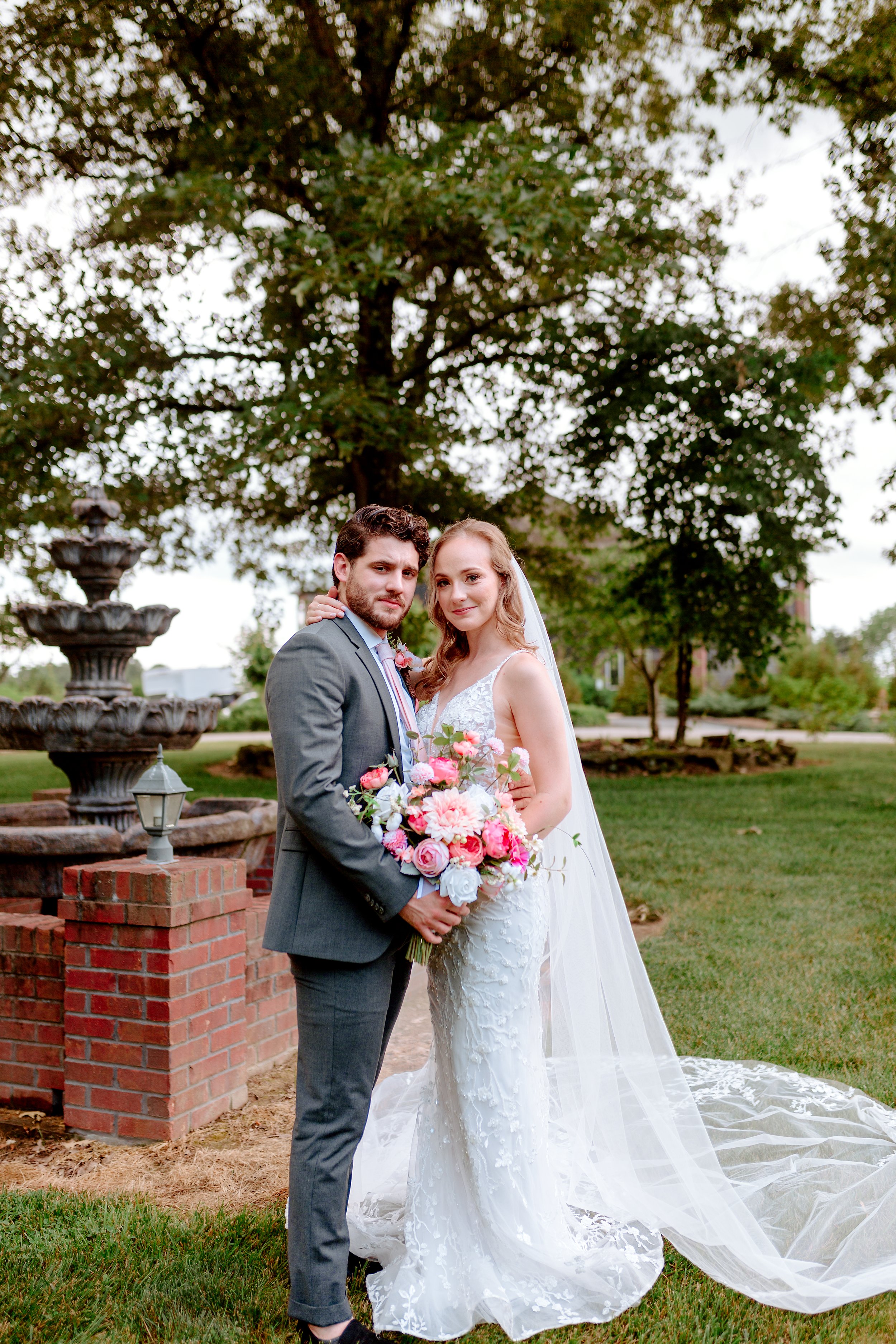 bride and groom posed together outside in bowling green kentucky at Tayvin Gardens venue