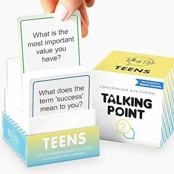A hand holding a card with the question, 'What is the most important value you have?' next to a box of Talking Point conversation cards for teens, with other cards visible.