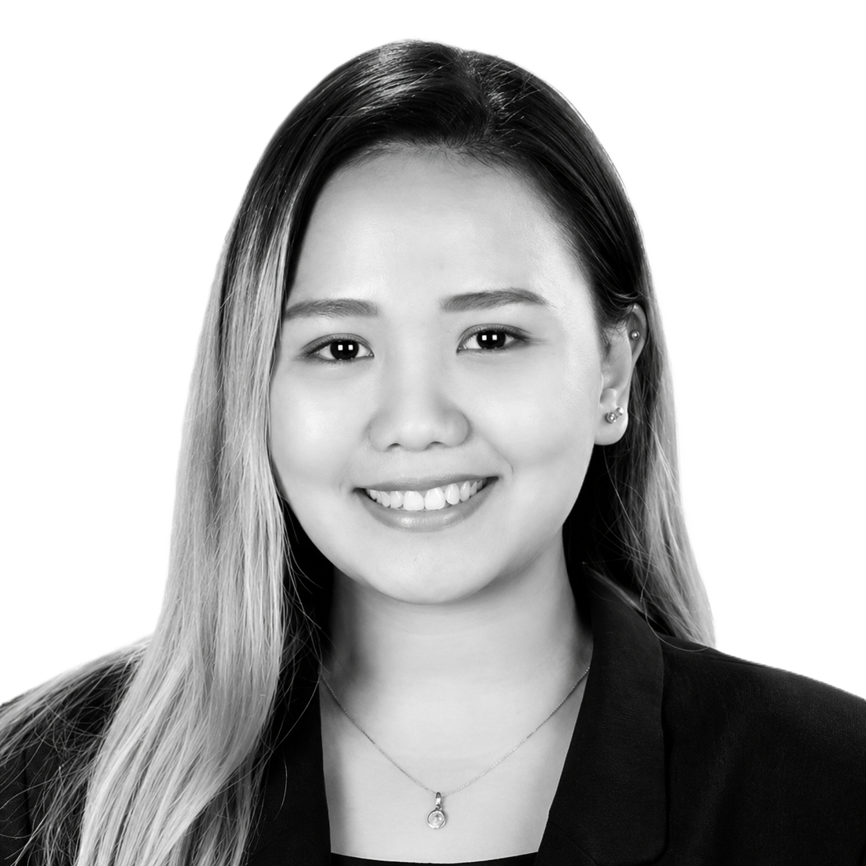 A black and white portrait Leah Vertudazo, dressed in a formal office wear.