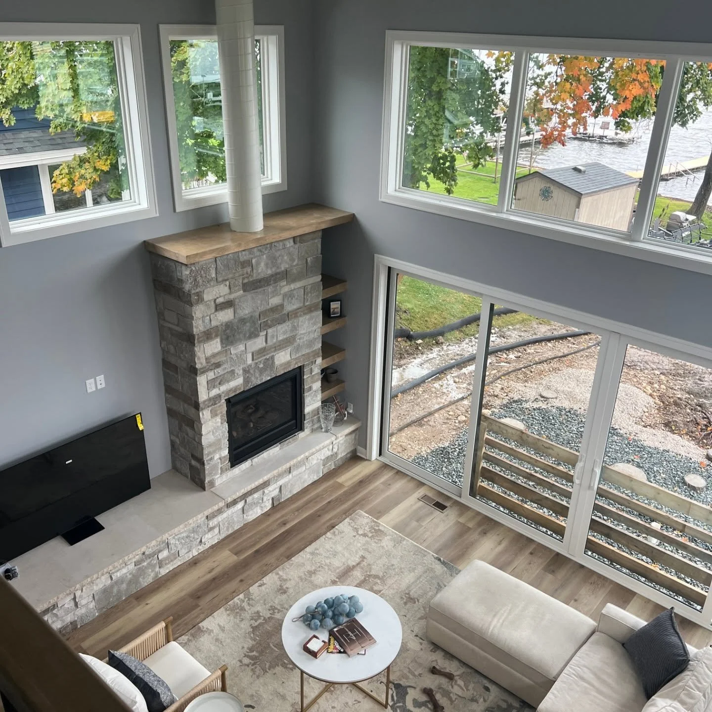 This is a home we designed on Pewaukee Lake. It has a beautiful two story living with views of the lake!! The kitchen has an awesome rolling ladder from Putnam Rolling Ladders.

@putnamladders
@customservicehardware

#lakehouse #lakelife #lakeview