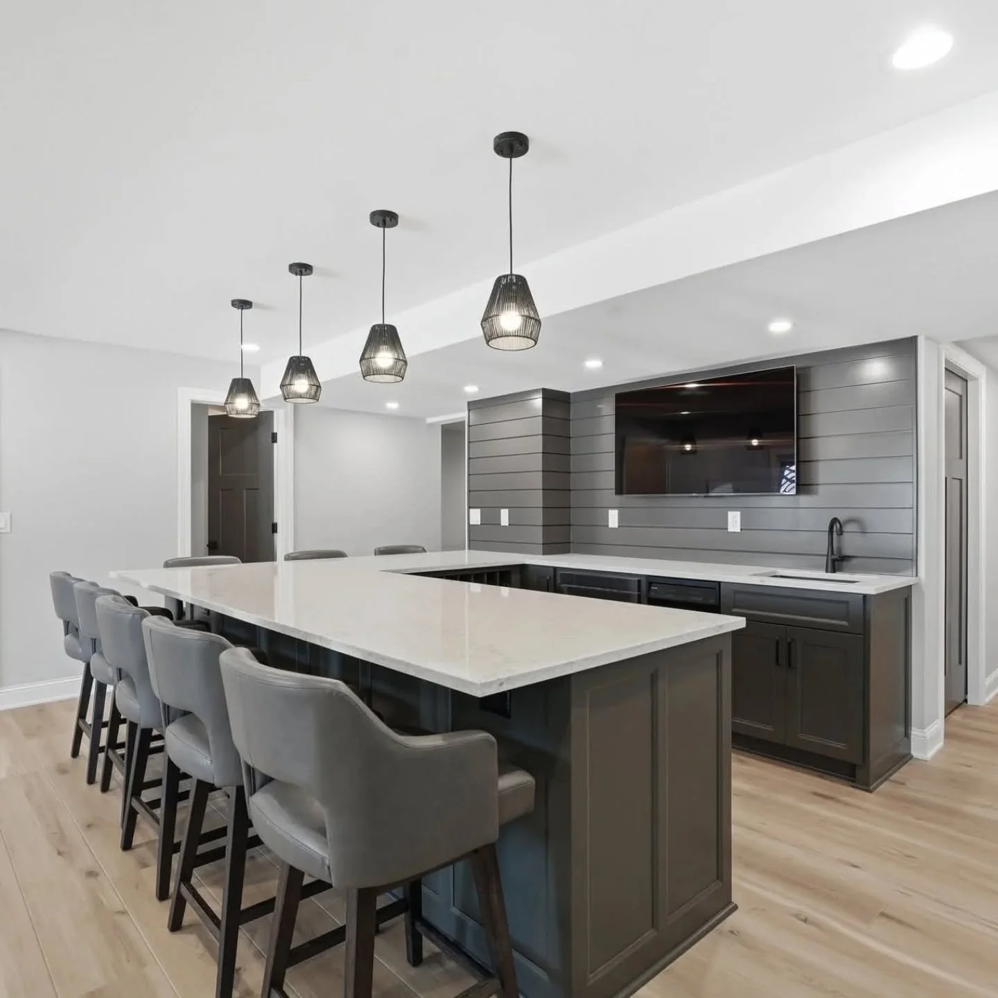 Finished basement we redesigned recently completed by @lifetime_renovation 

#remodel #finishedbasement #basementbar #wetbar #interiordesign
