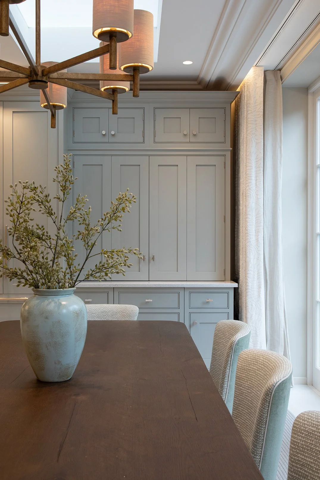 A kitchen with painted cabinetry
