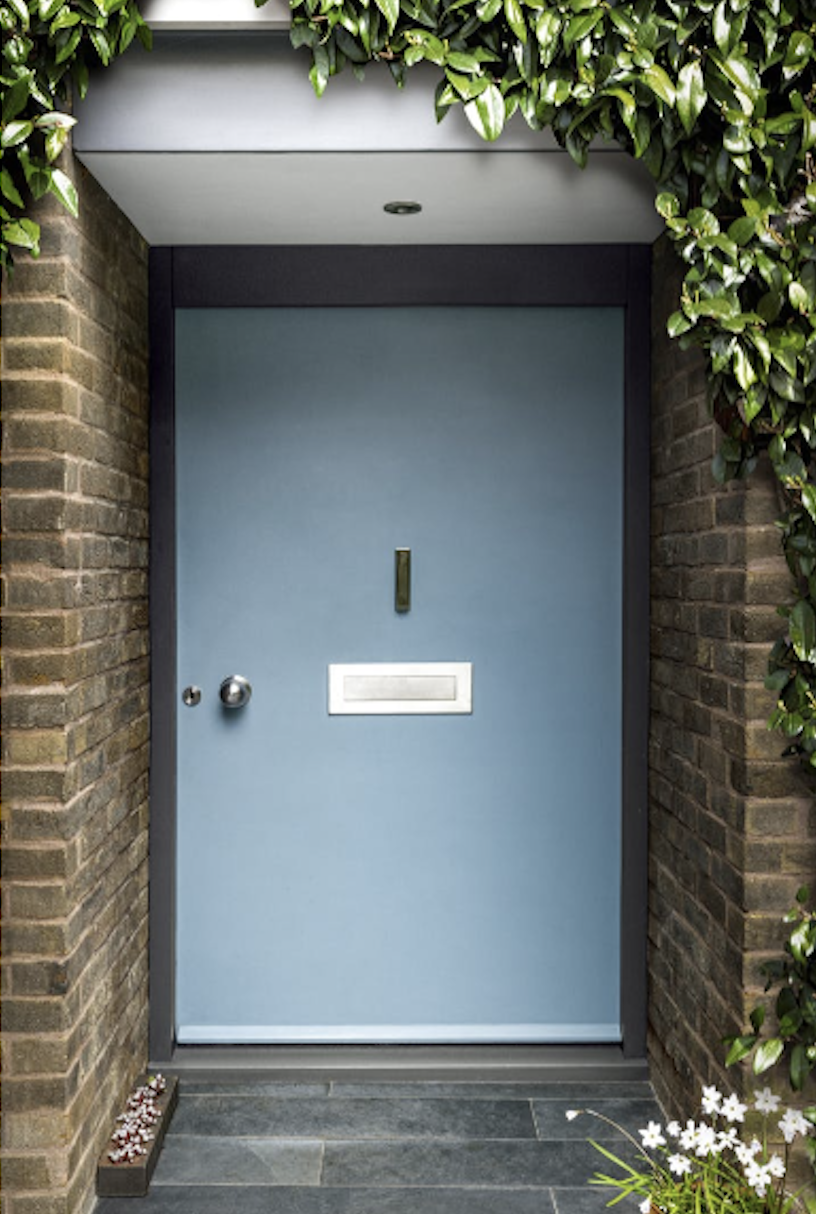 A modern front door in pale blue