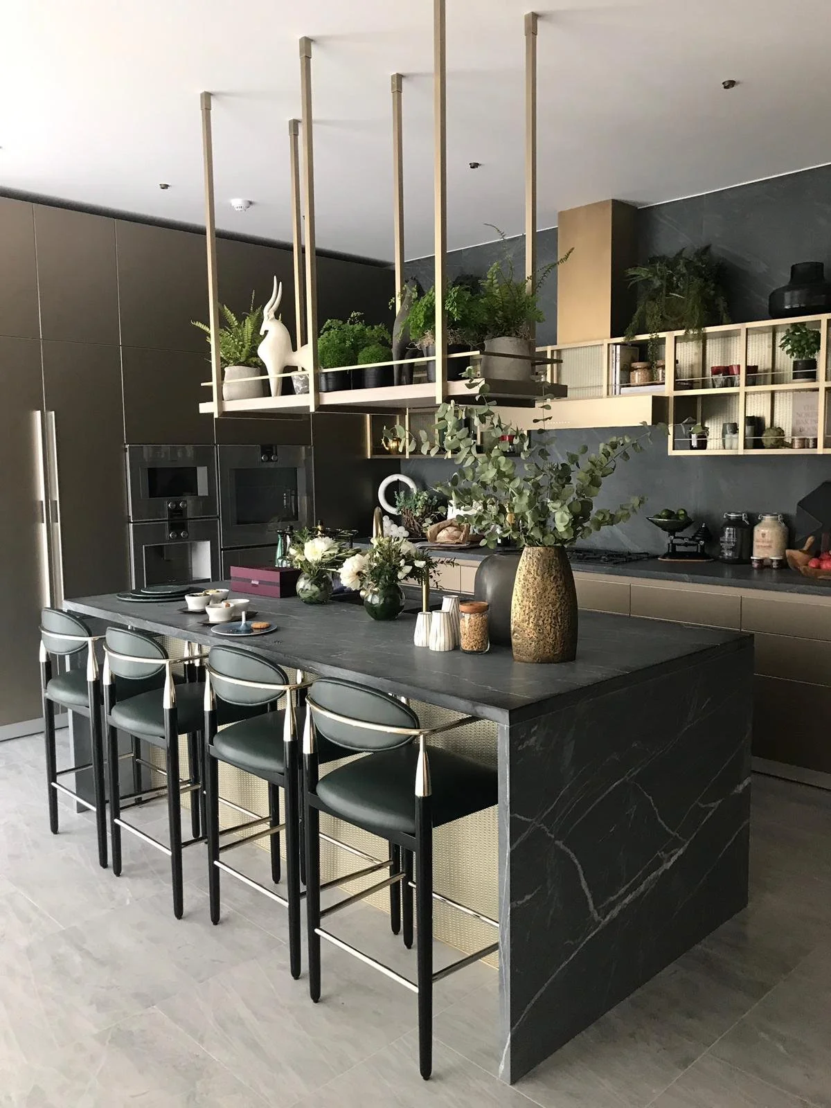 Small kitchen with island and suspended shelving