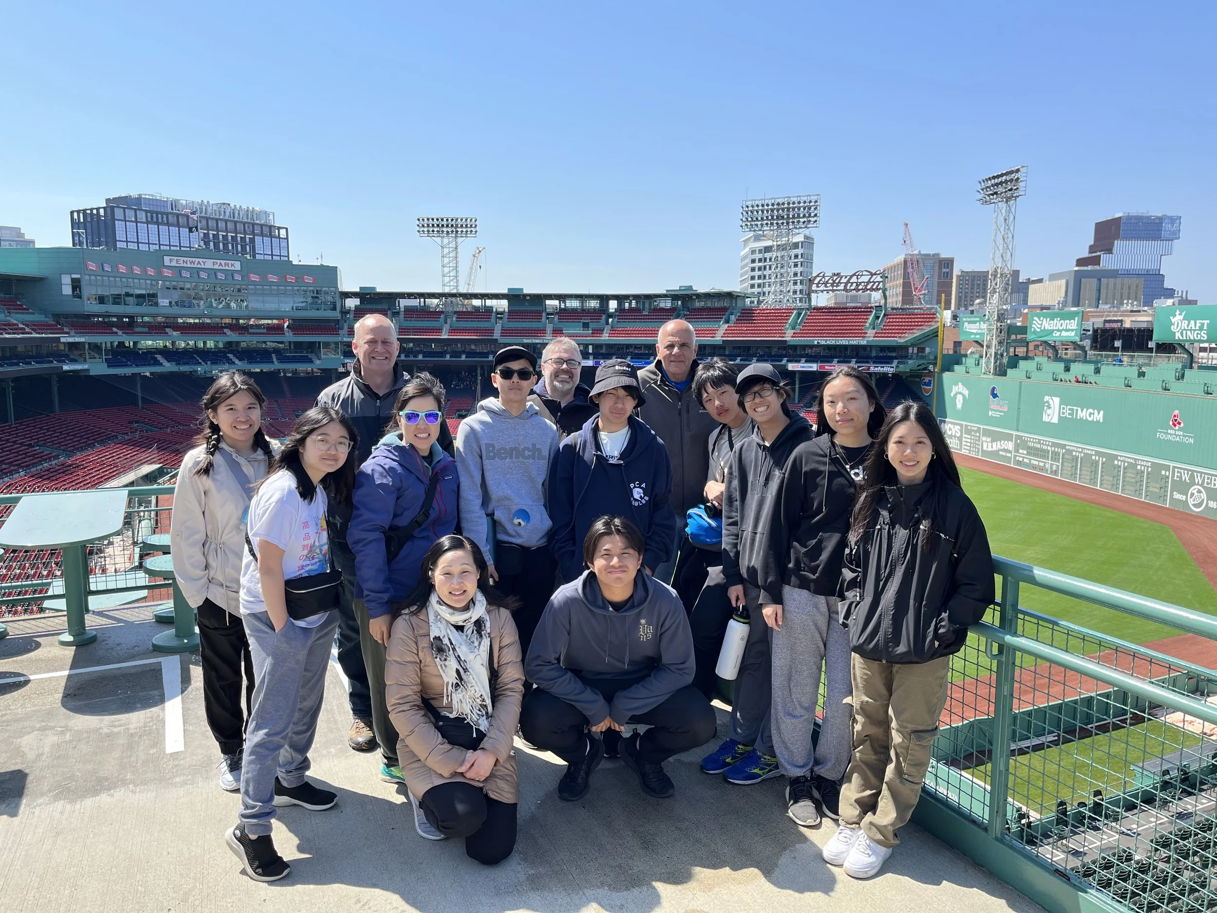 Day 6 - Mission team members take a group photo at Fenway Park