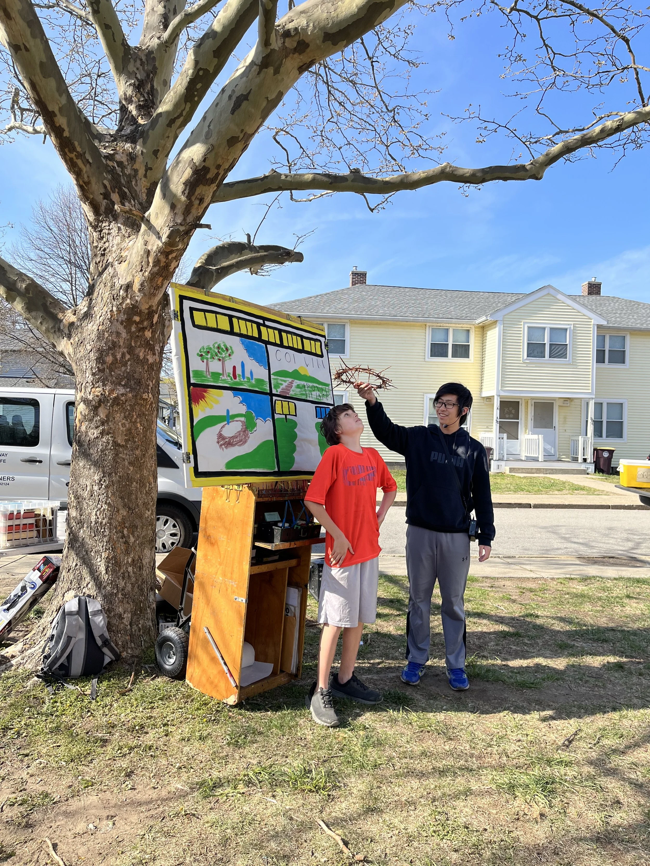 Day 6 - Mission team members sharing the Gospel story of God giving His only son to the world with neighbourhood children at Kids Camp
