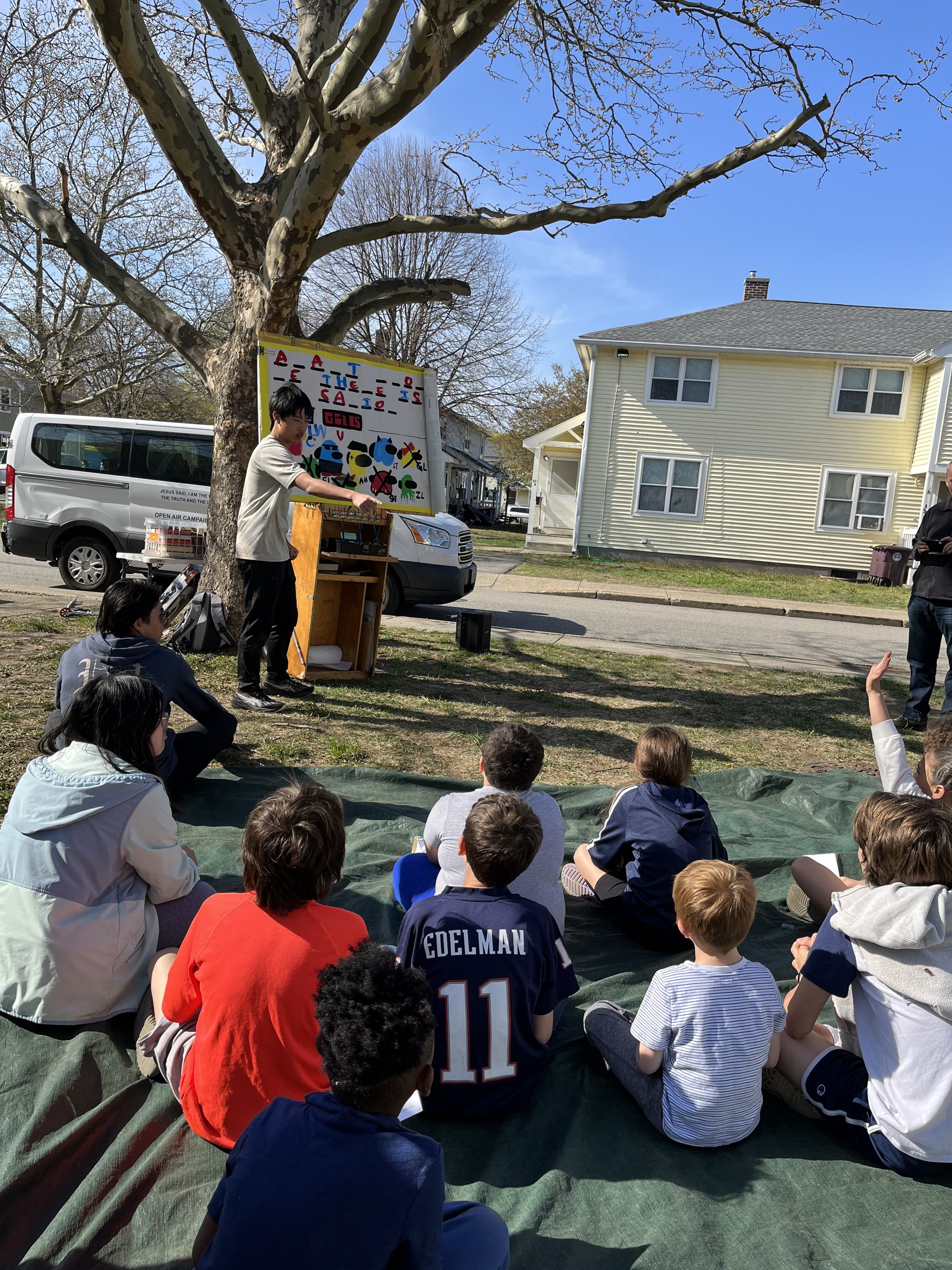 Day 6 - Mission team members sharing a message with neighbourhood children at Kids Camp