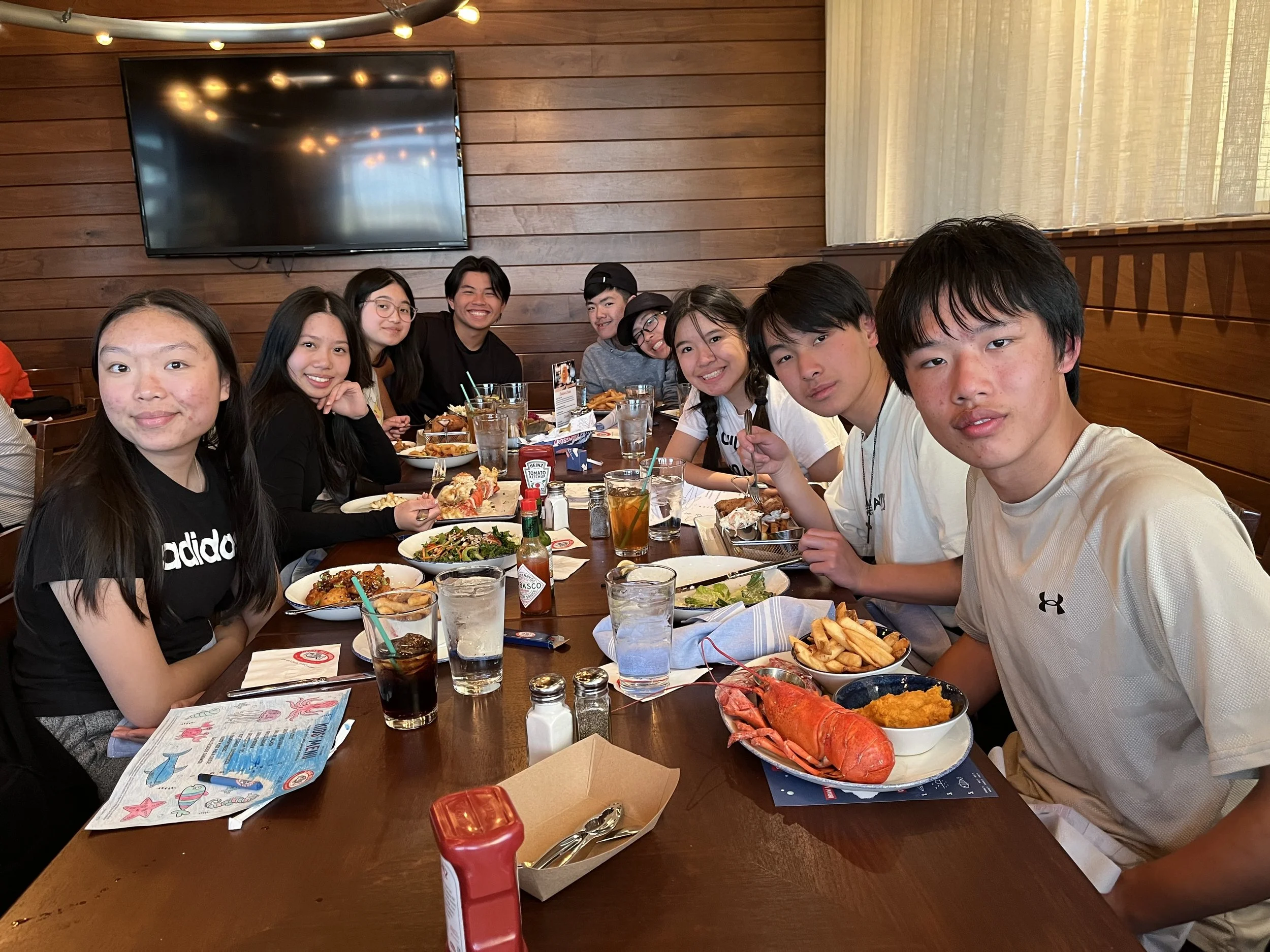 Day 6 - Mission team members enjoying a meal together at a seafood restaurant