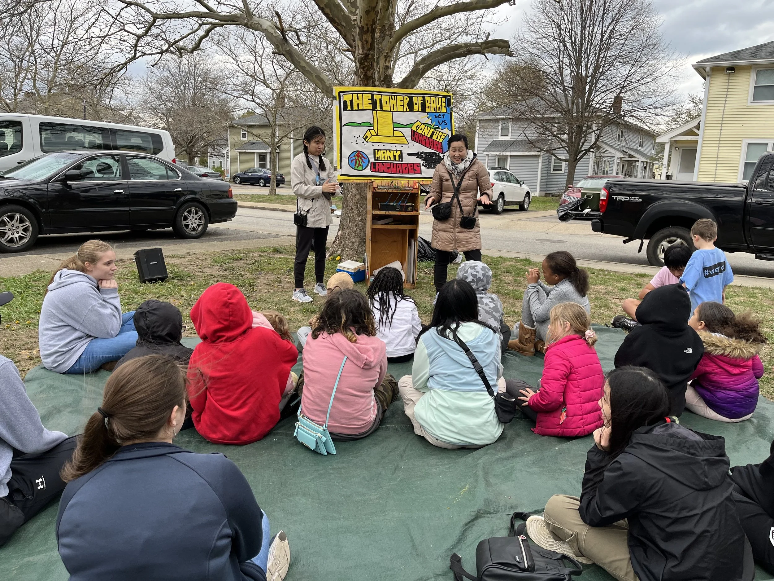 Day 3 - Mission team members sharing the story of the Tower of Babel with  neighbourhood children at Kids Camp