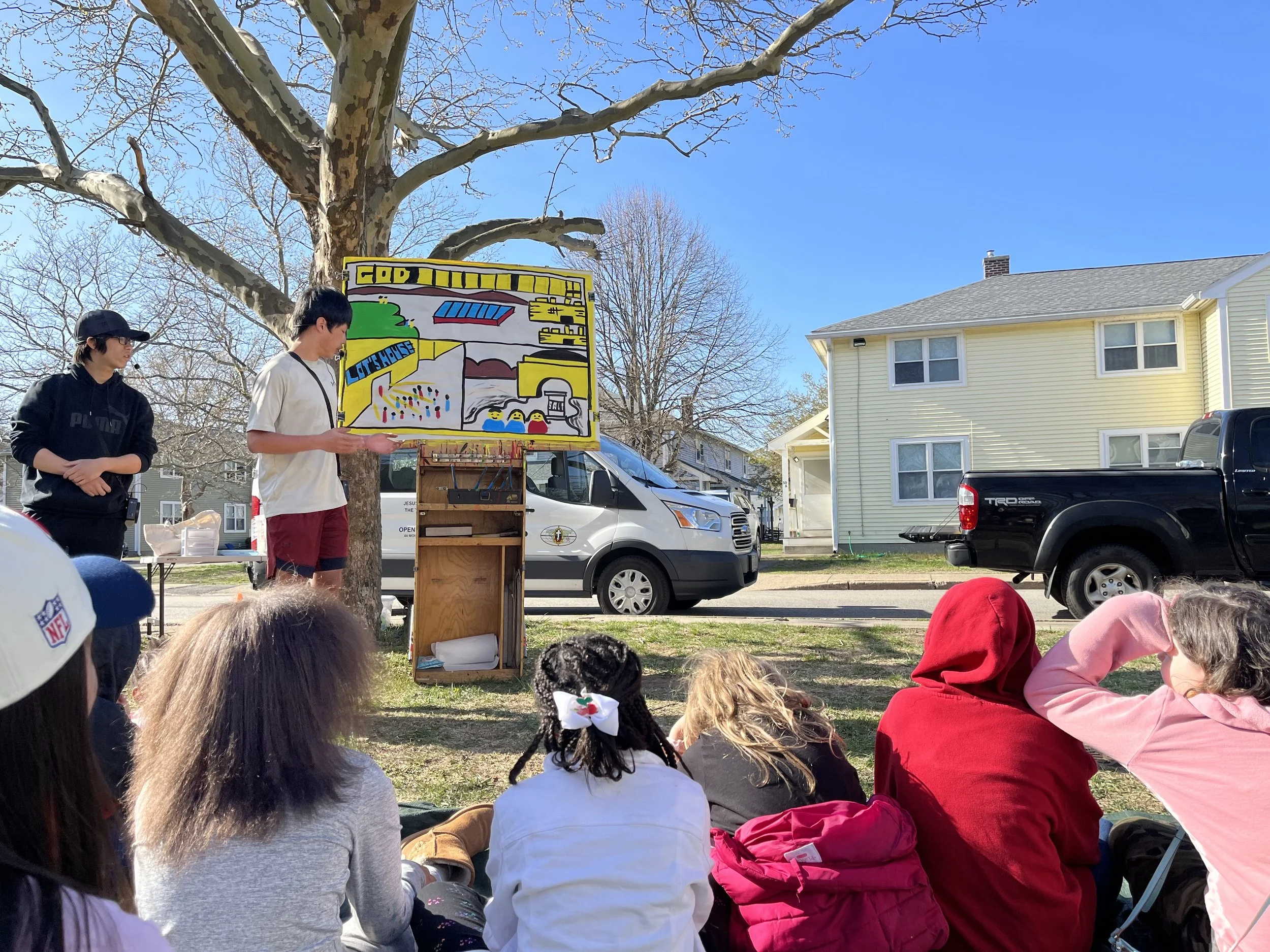 Day 5 - Mission team members sharing the story of Lot and God's mercy with  neighbourhood children at Kids Camp