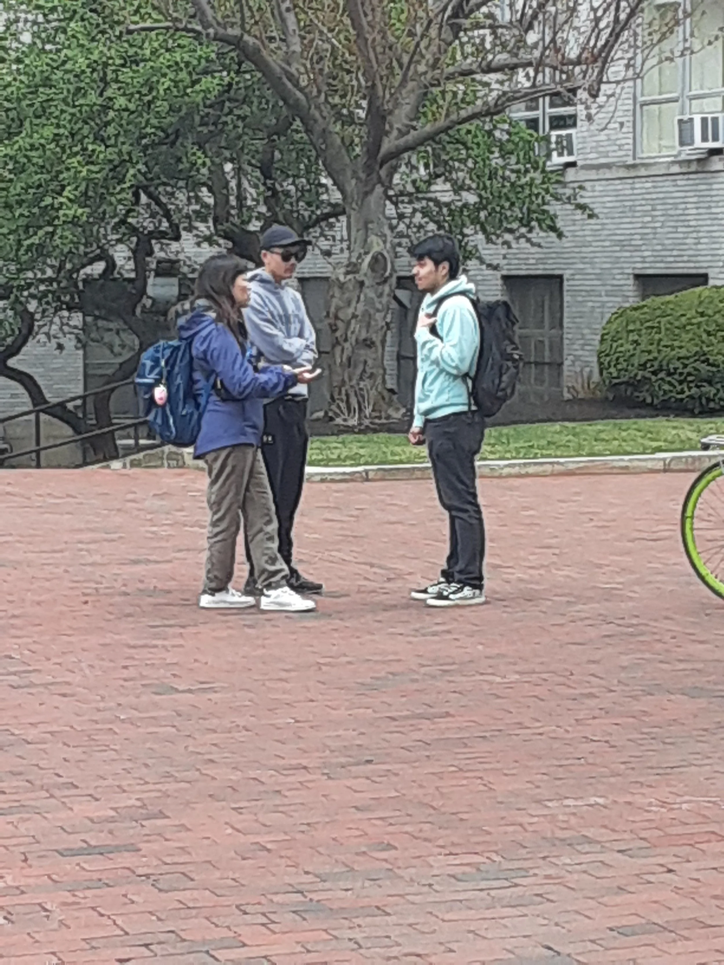 Day 3 - Mission team members interacting with a student on Boston university campus