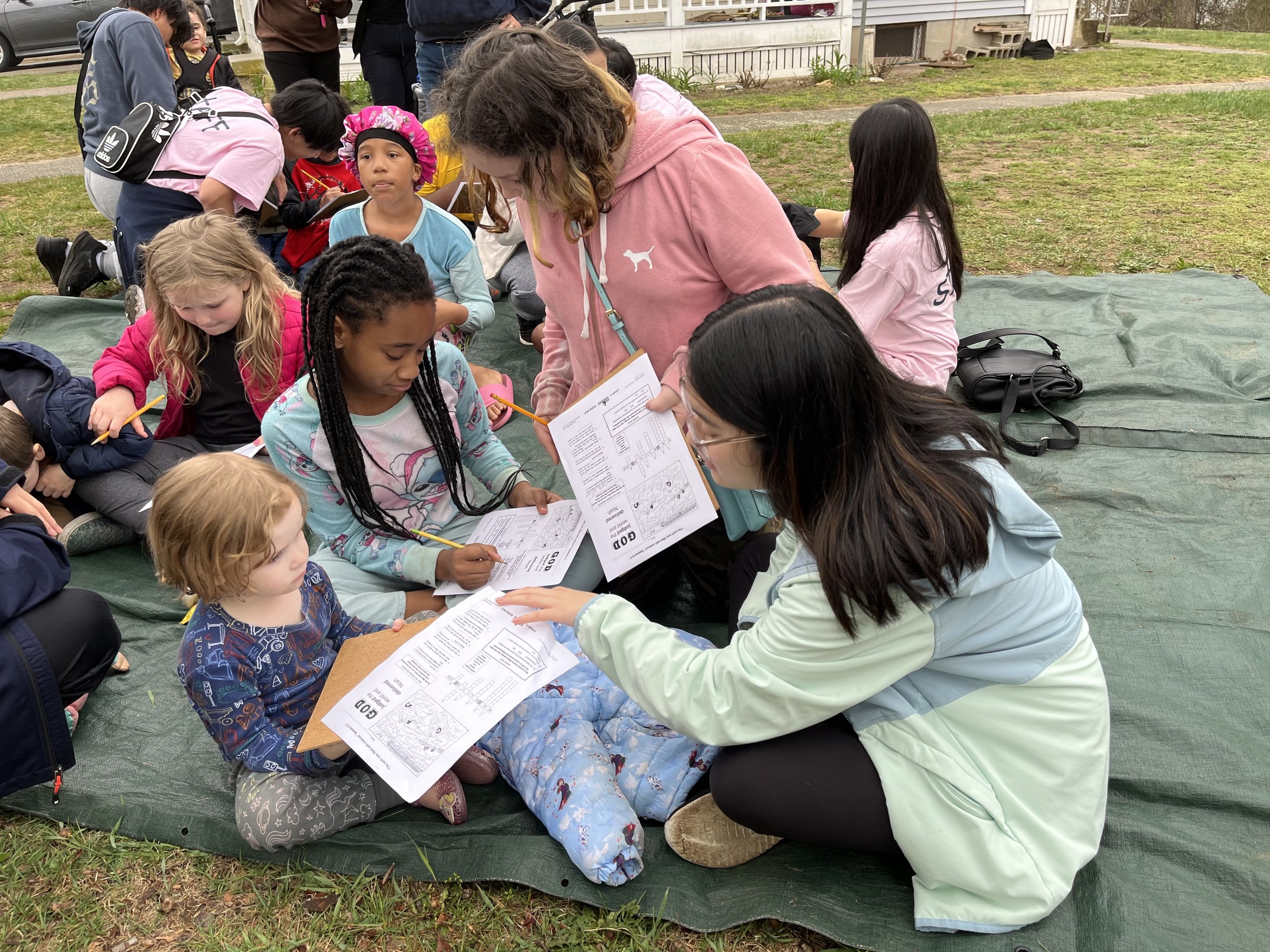 Day 2 - Mission team members are working with neighbourhood children on an activity