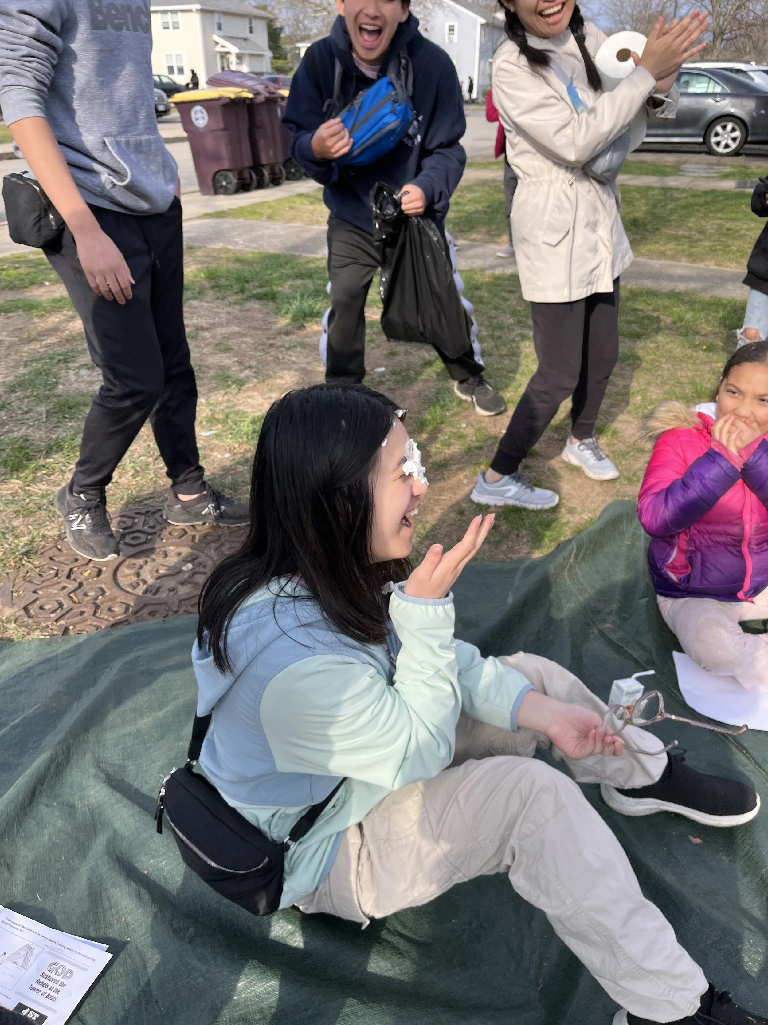 Day 3 - Mission team members playing PieFace with neighbourhood children