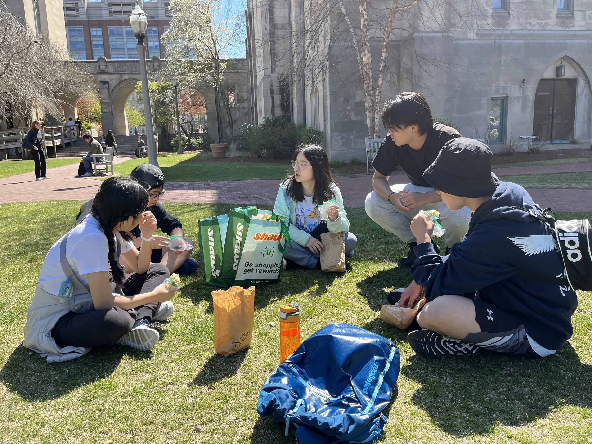 Day 5 - Mission team members enjoying a meal together outside of a church on a sunny day