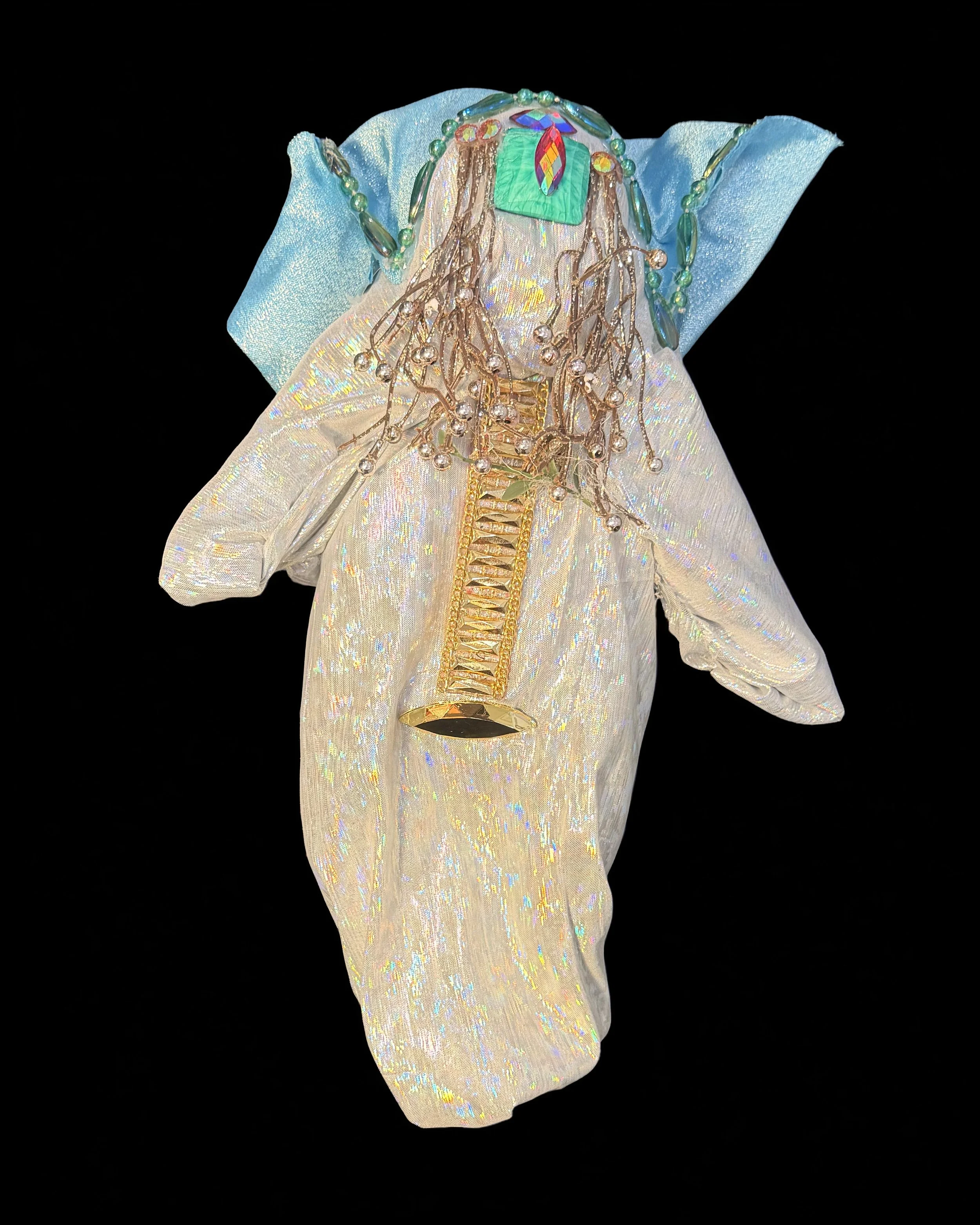  Ascension Spirit   
Soft Sculpture 
 Found Materials   
Discarded Doll, Fabric,  
Found Natural Materials,  
Costume Jewelry, Plastic Gems