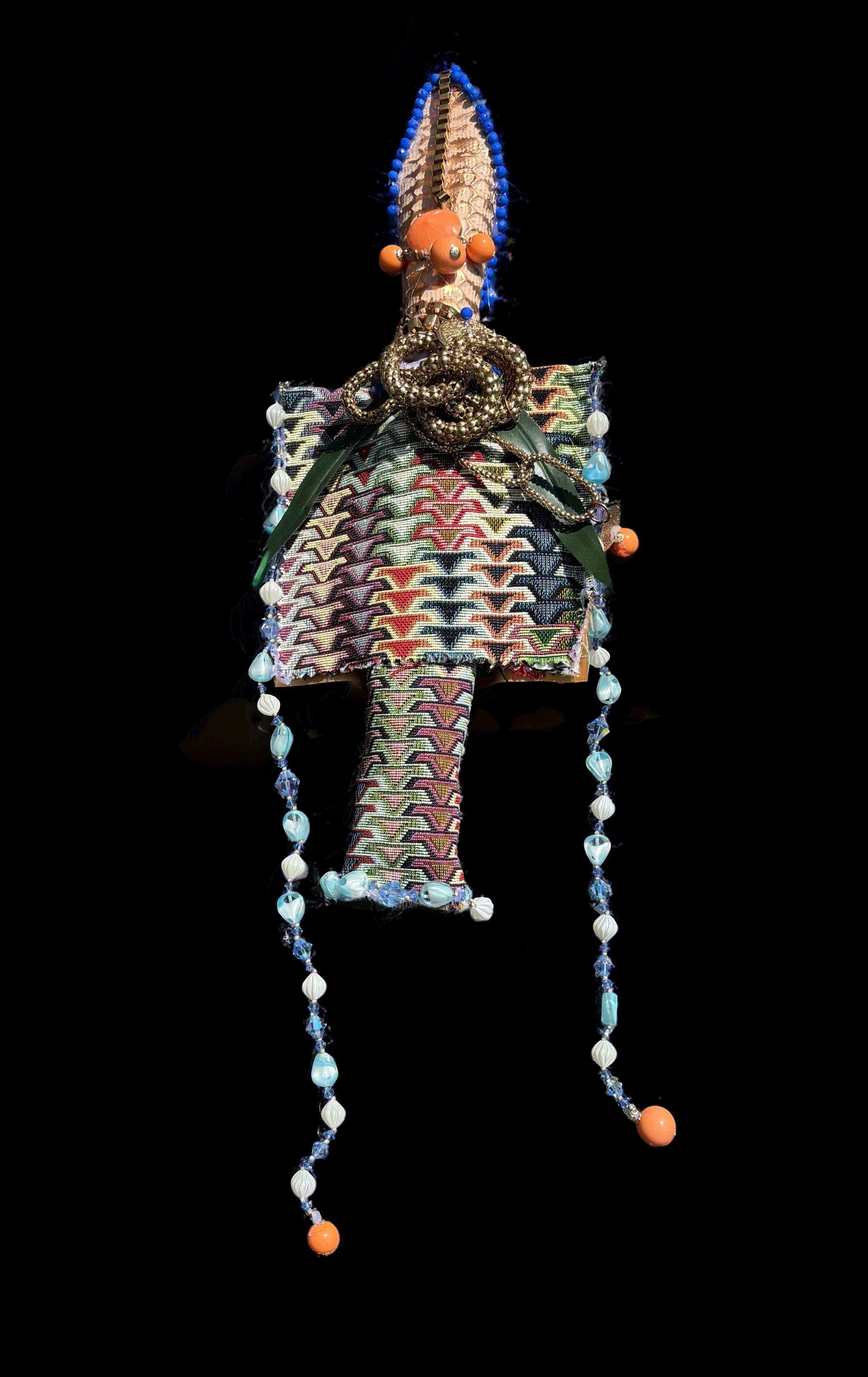  Ascension Spirit   
Soft Sculpture 
 Found Materials   
Discarded Doll, Fabric,  
Found Natural Materials,  
Costume Jewelry, Plastic Gems