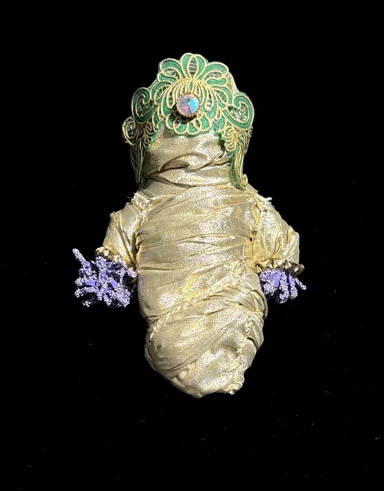  Ascension Spirit   
Soft Sculpture 
 Found Materials   
Discarded Doll, Fabric,  
Found Natural Materials,  
Costume Jewelry, Plastic Gems