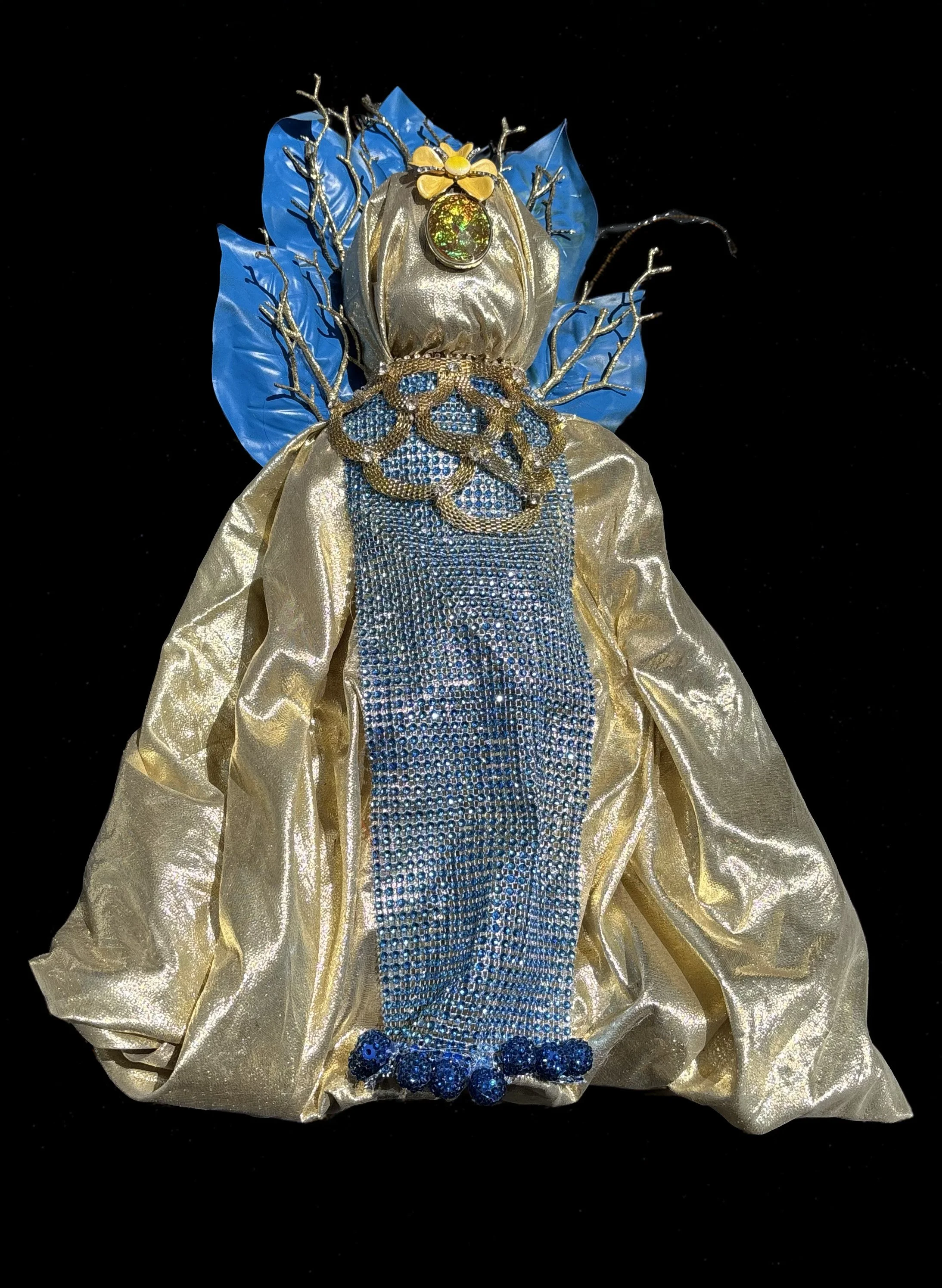  Ascension Spirit   
Soft Sculpture 
 Found Materials   
Discarded Doll, Fabric,  
Found Natural Materials,  
Costume Jewelry, Plastic Gems