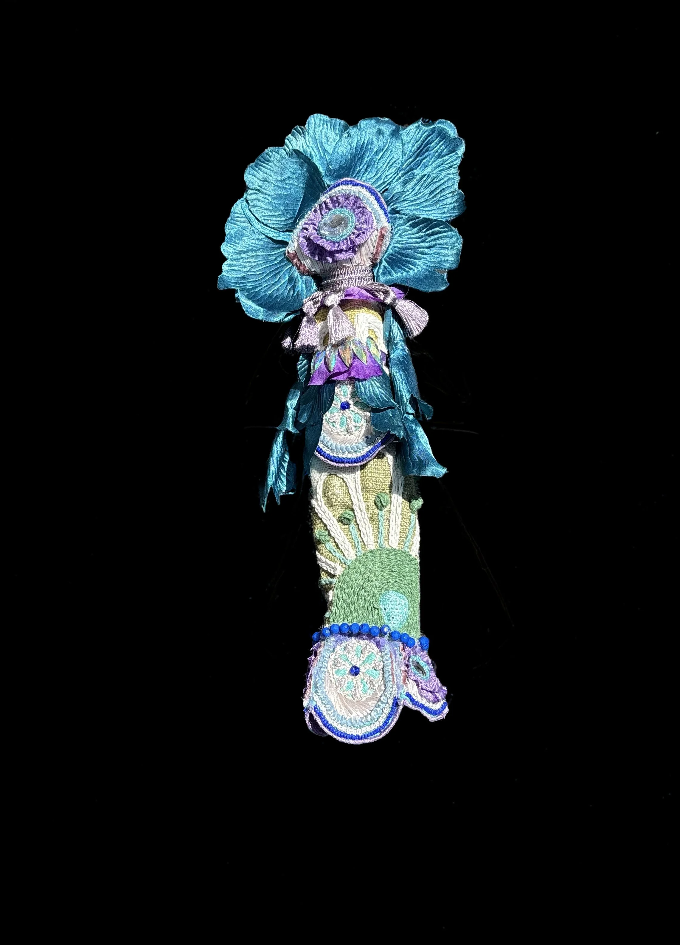  Ascension Spirit   
Soft Sculpture 
 Found Materials   
Discarded Doll, Fabric,  
Found Natural Materials,  
Costume Jewelry, Plastic Gems