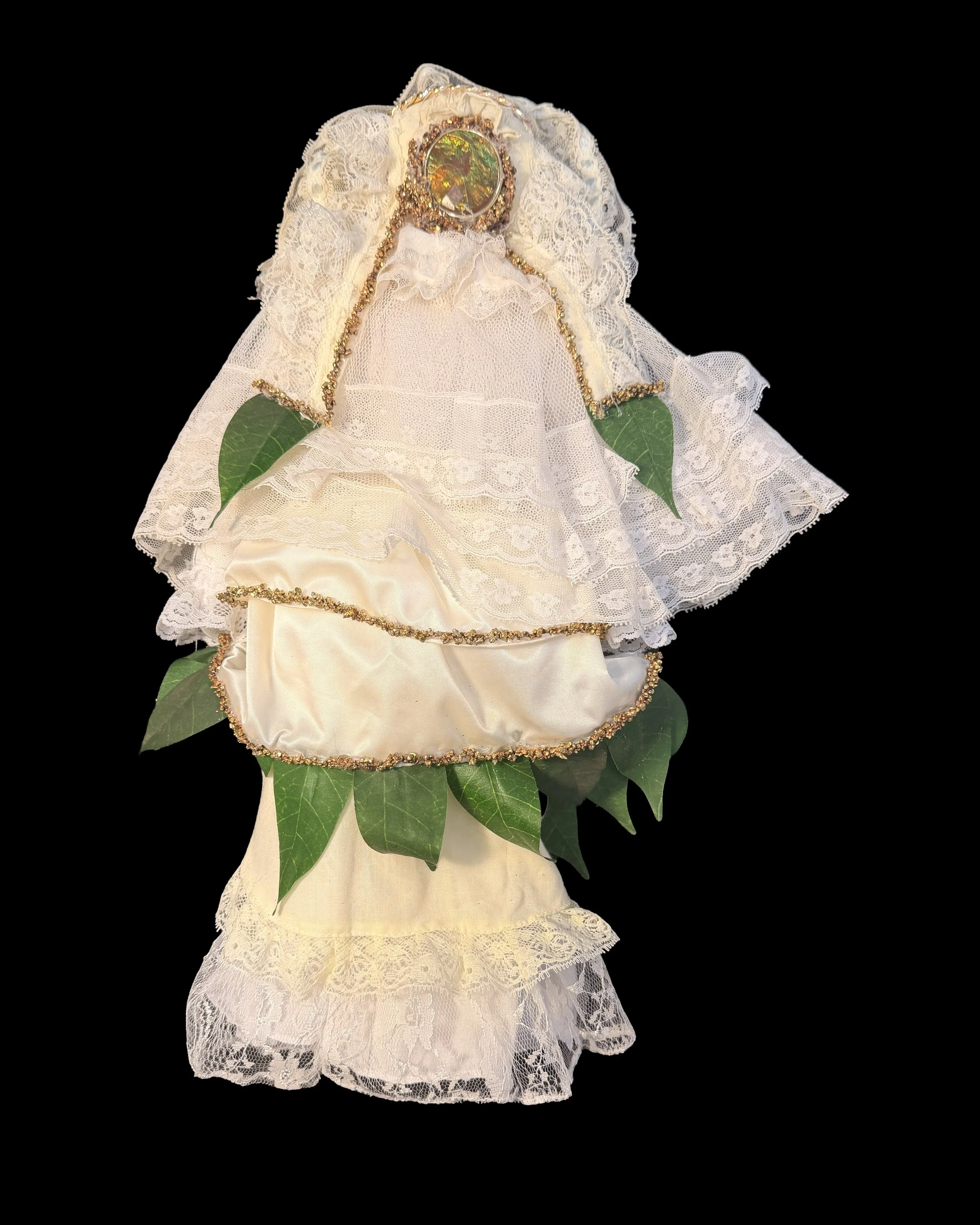  Ascension Spirit   
Soft Sculpture 
 Found Materials   
Discarded Doll, Fabric,  
Found Natural Materials,  
Costume Jewelry, Plastic Gems