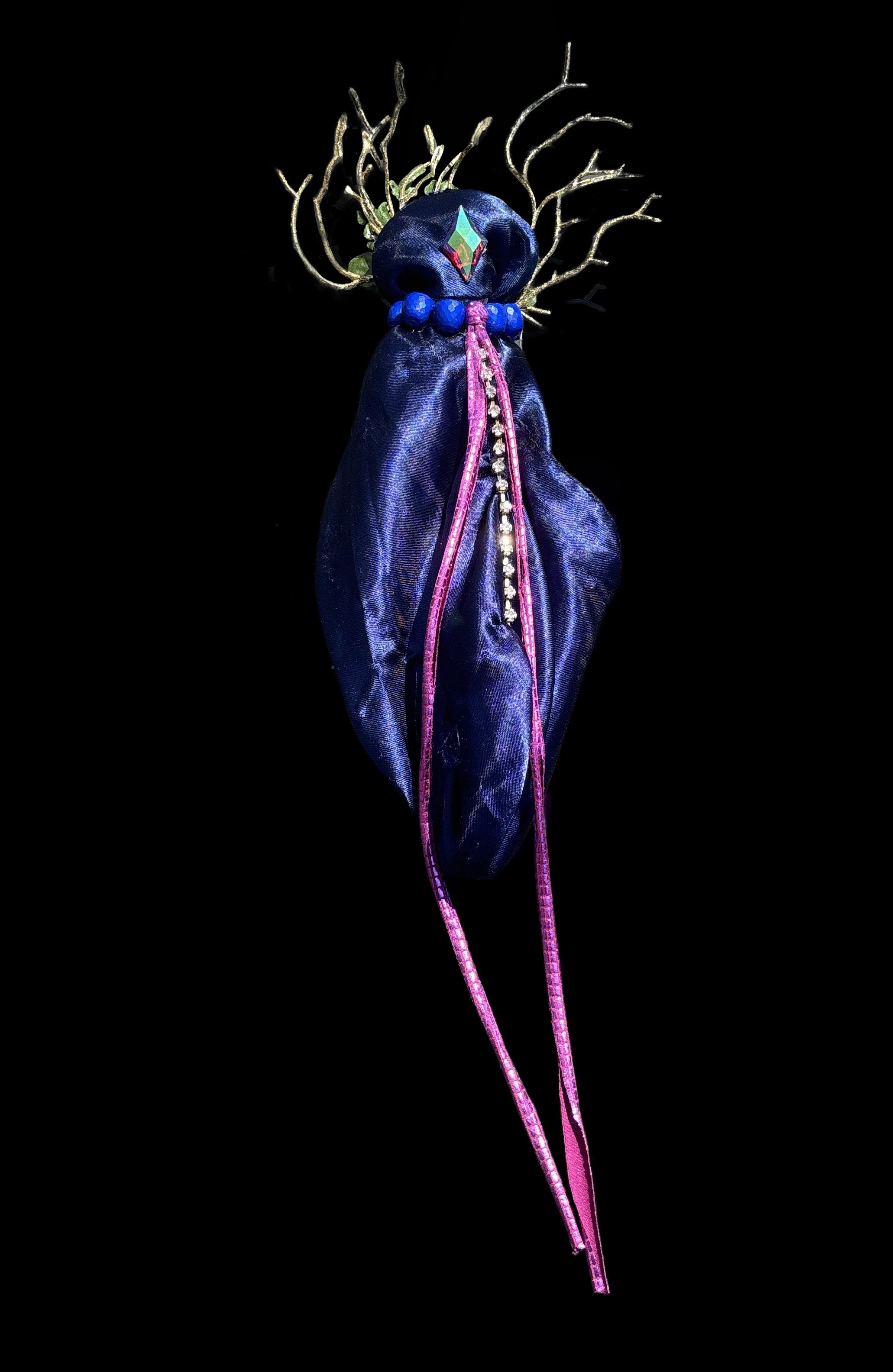  Ascension Spirit   
Soft Sculpture 
 Found Materials   
Discarded Doll, Fabric,  
Found Natural Materials,  
Costume Jewelry, Plastic Gems