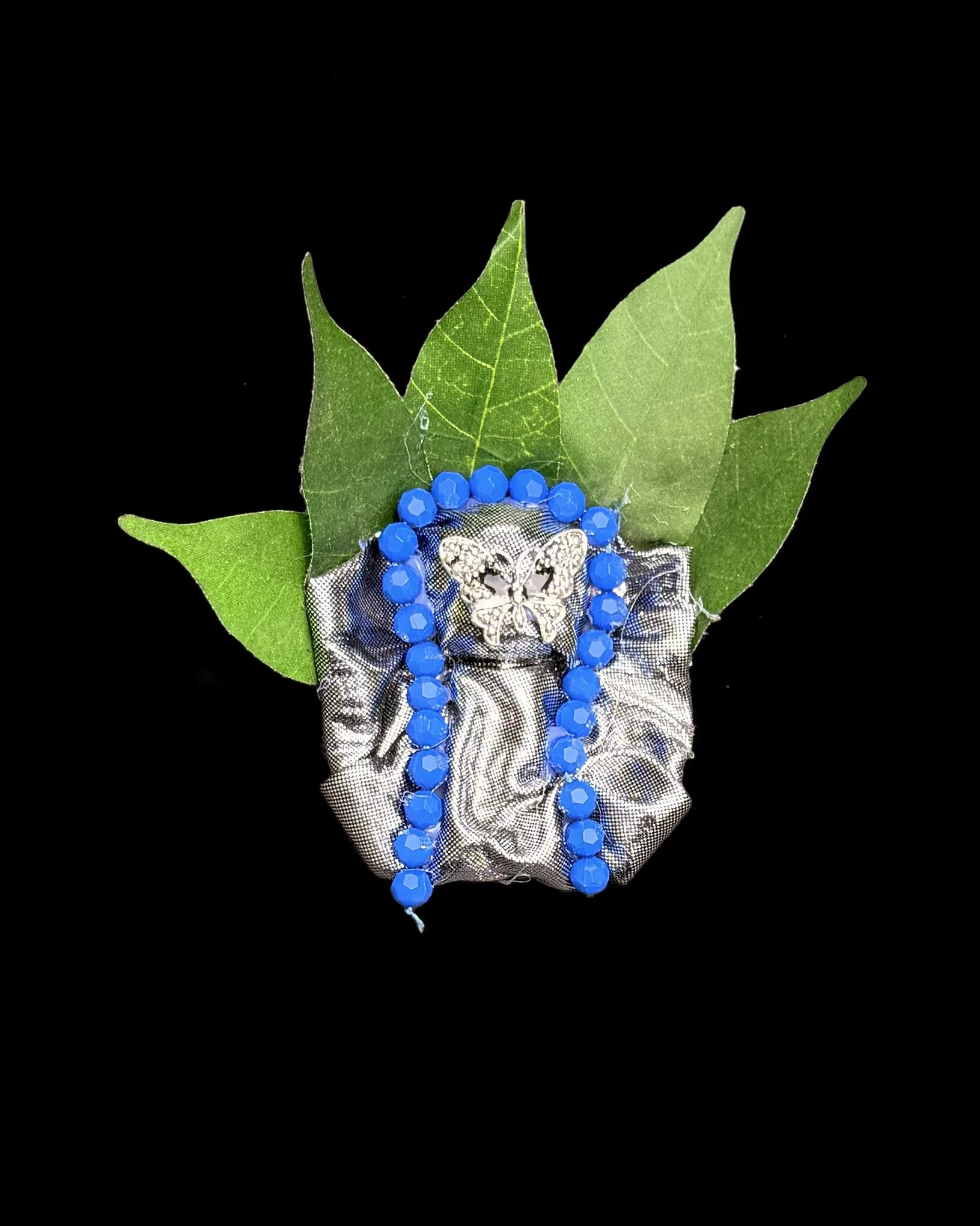  Ascension Spirit   
Soft Sculpture 
 Found Materials   
Discarded Doll, Fabric,  
Found Natural Materials,  
Costume Jewelry, Plastic Gems