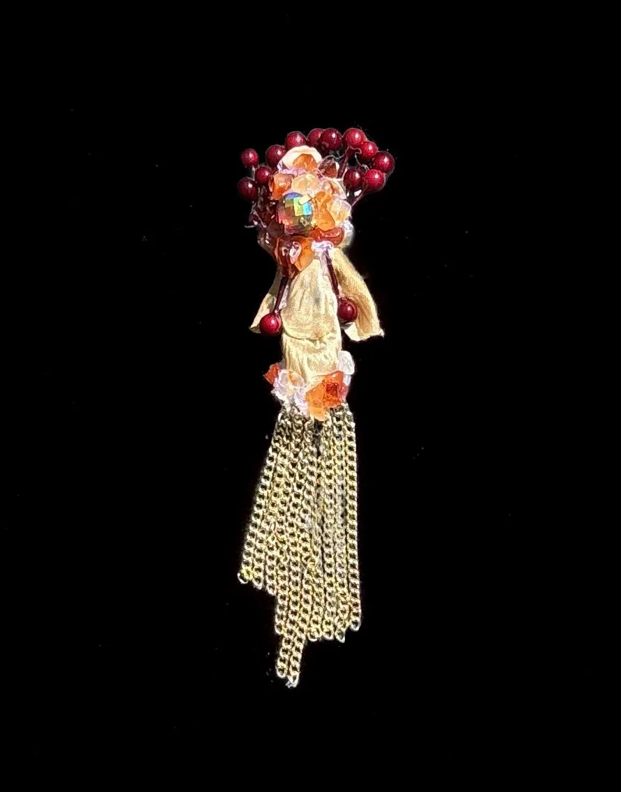  Ascension Spirit   
Soft Sculpture 
 Found Materials   
Discarded Doll, Fabric,  
Found Natural Materials,  
Costume Jewelry, Plastic Gems